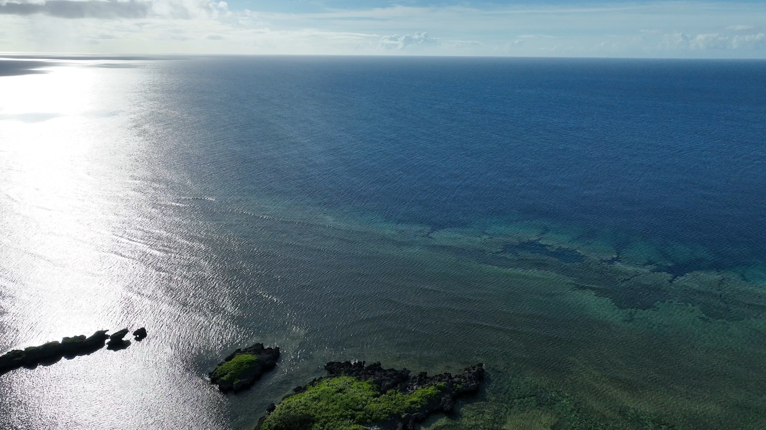 A beautiful landscape featuring blue ocean and green islands