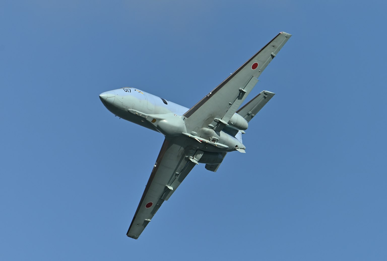 Aircraft in ascent against a blue sky