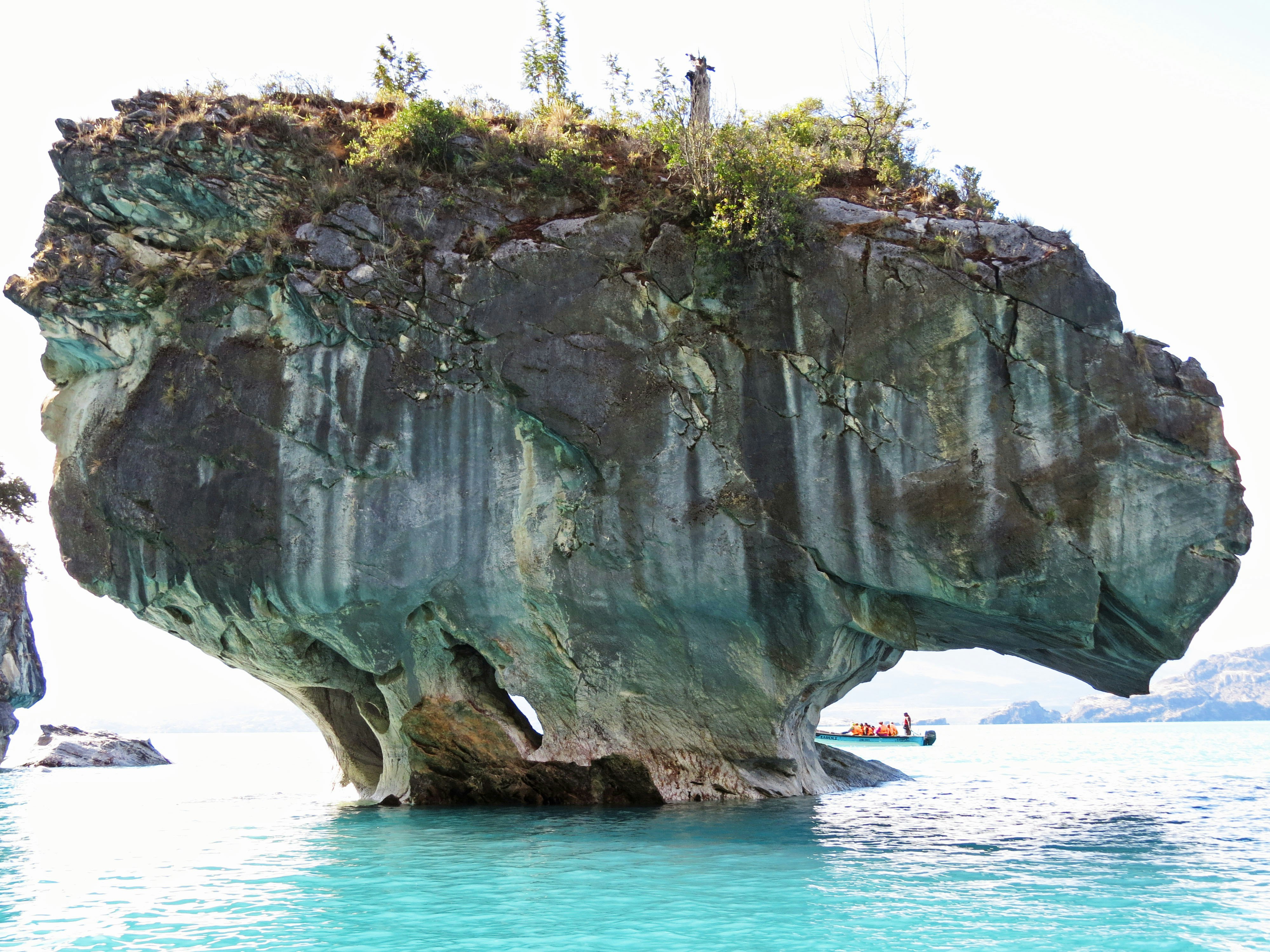 massive sea rock jutting into the ocean