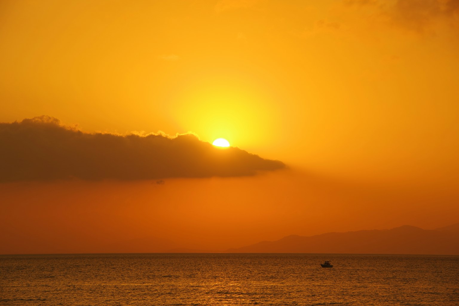 Beautiful sunset over the ocean with orange and yellow hues