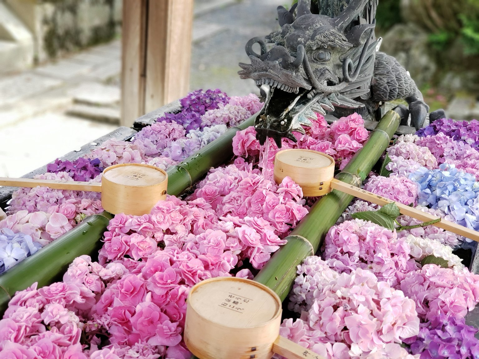Traditional decoration featuring a dragon sculpture and colorful flowers