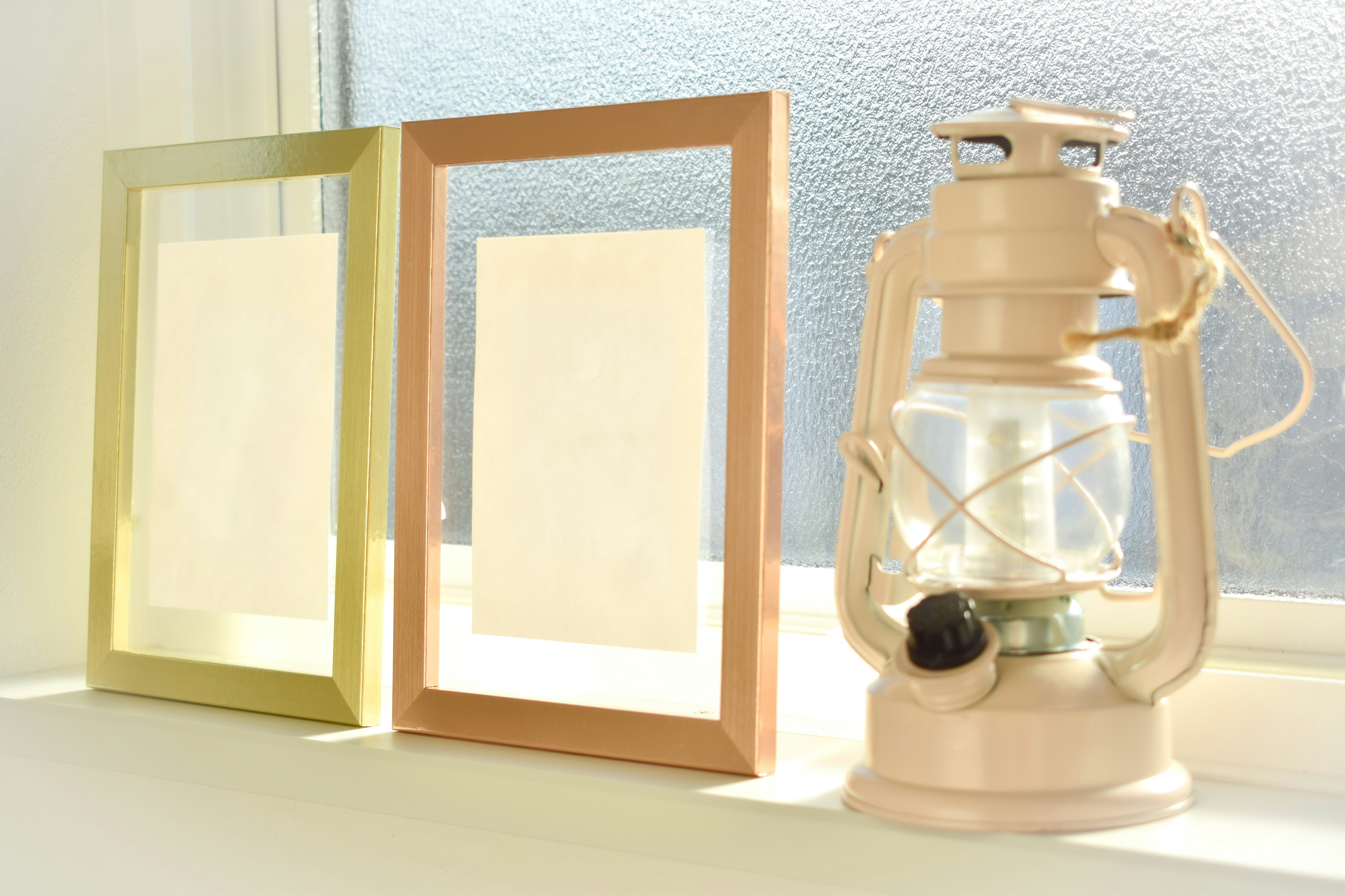 Indoor still life with a wooden frame and glass lantern