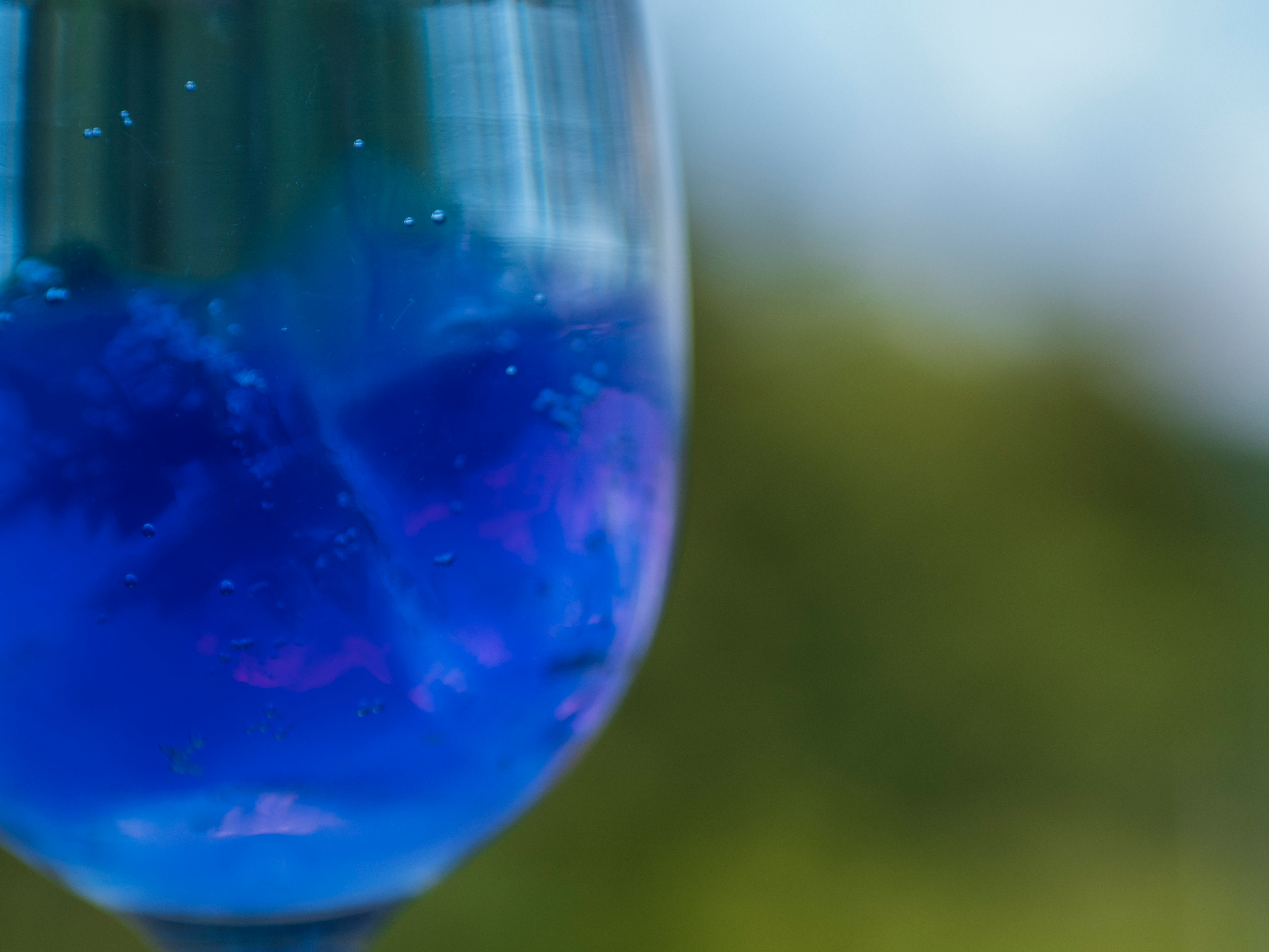 close-up of a glass container filled with blue liquid
