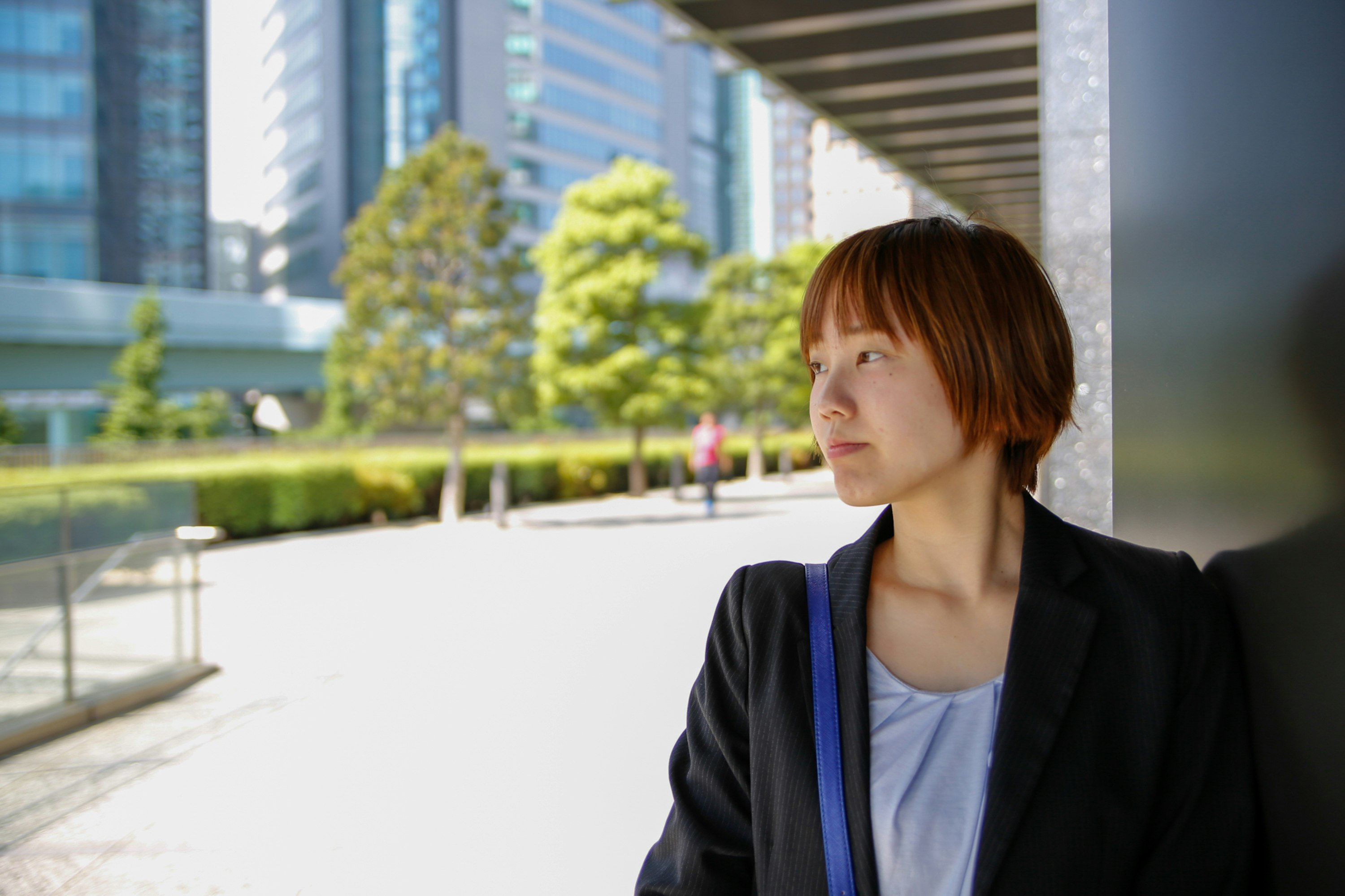 woman conversing outdoors in a business district