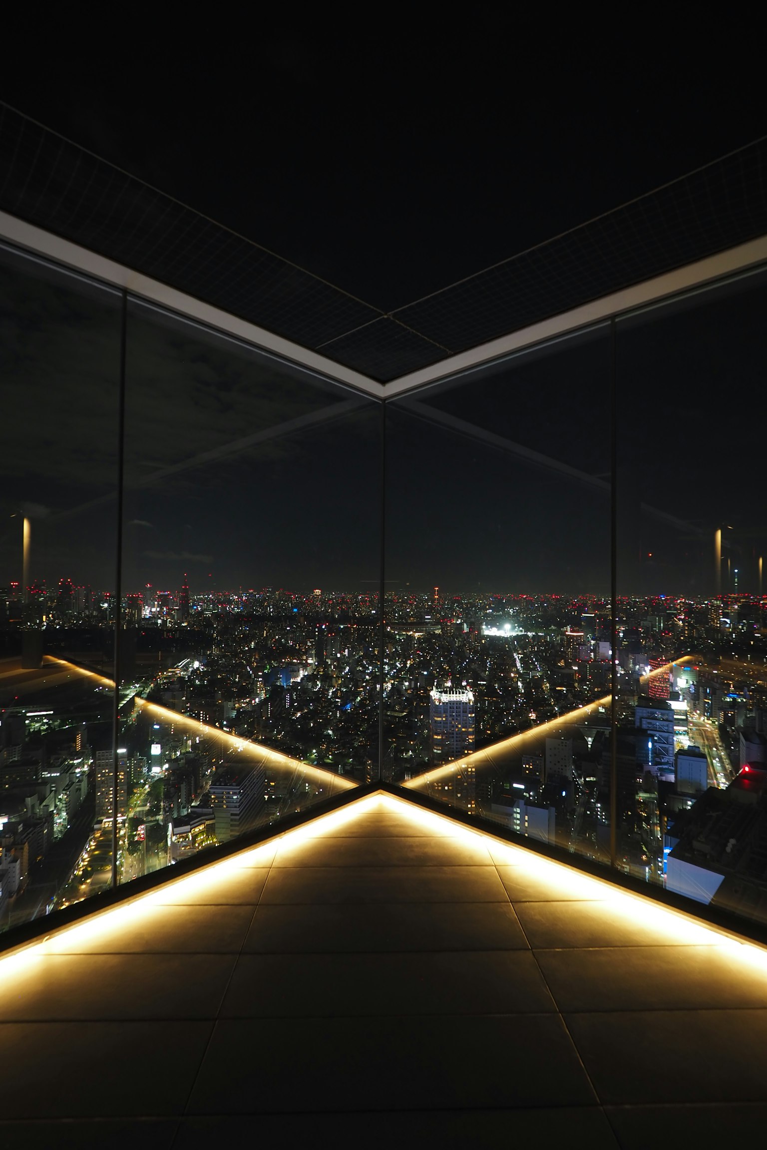 Modern window design with city lights at night