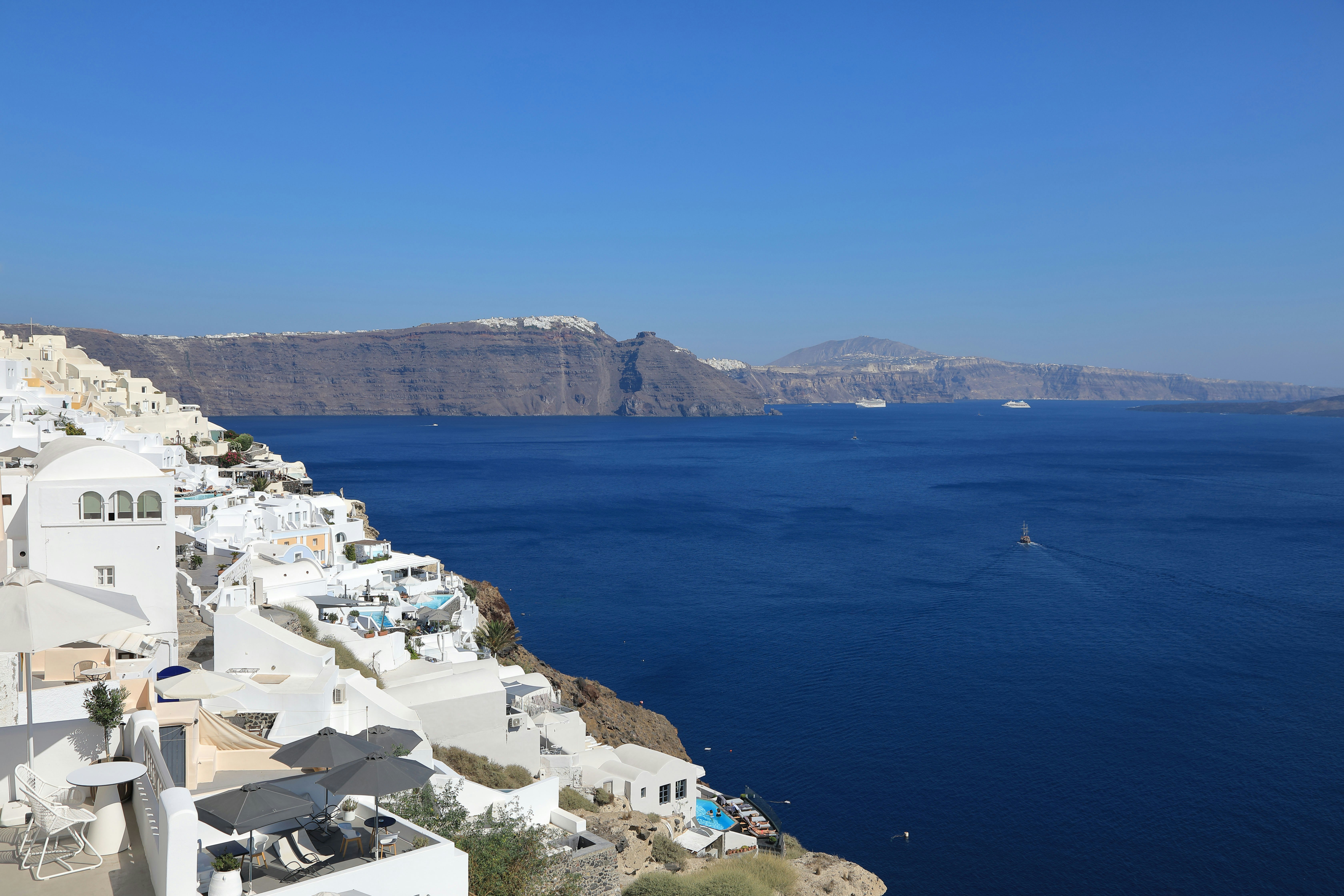 Santorini island seaside view with white-and-blue buildings
