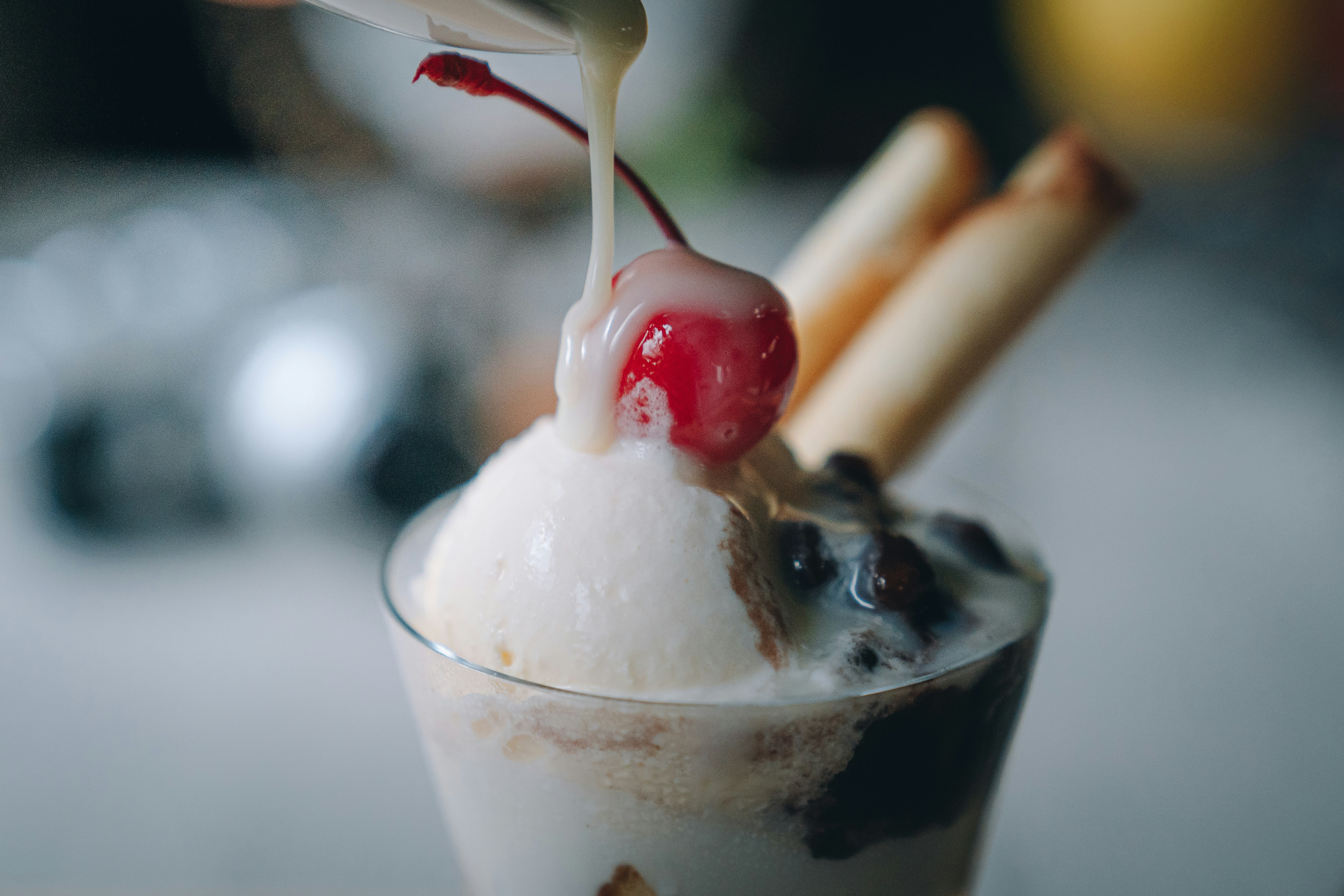 ice cream dessert in a glass with a cherry