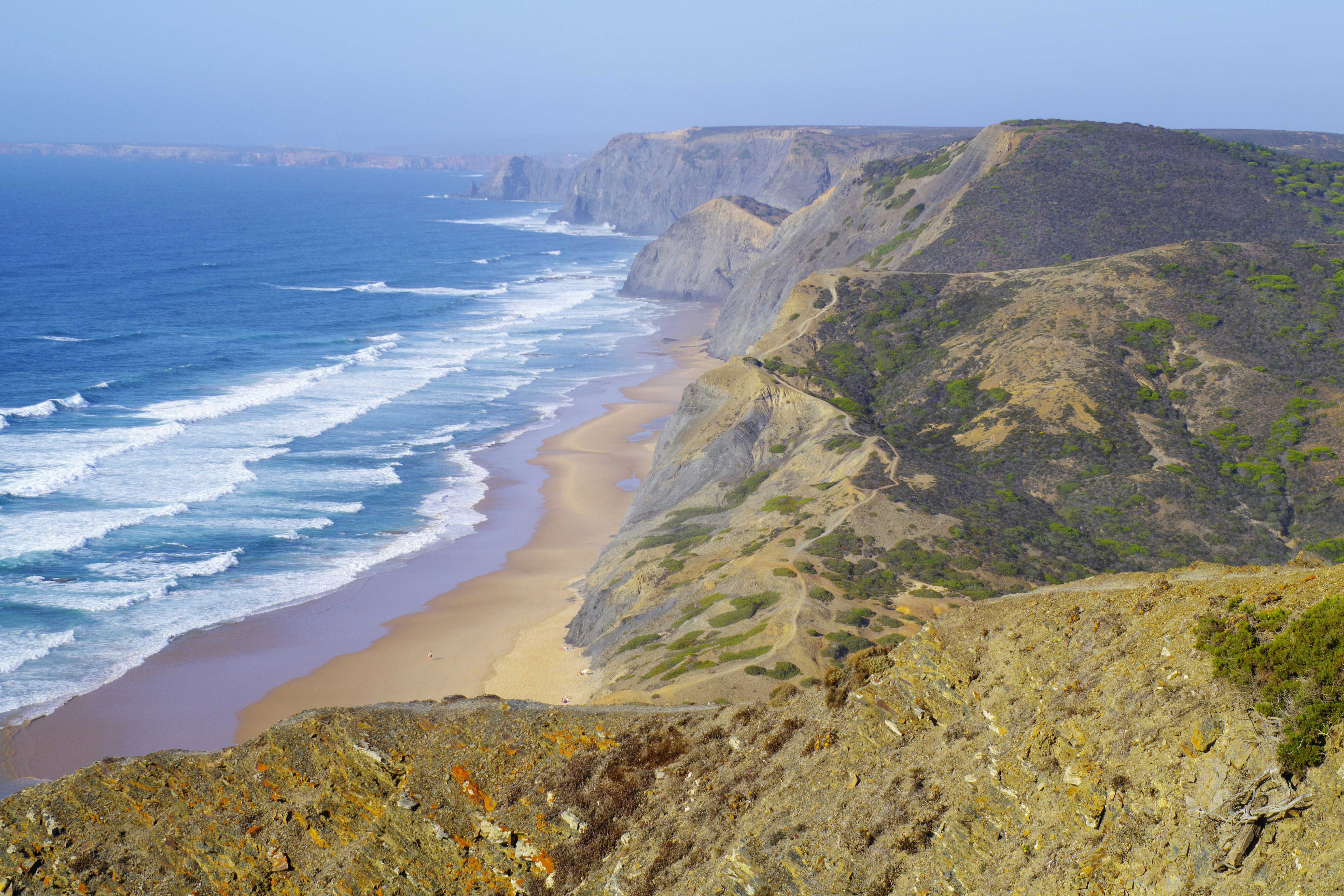 coastal panorama with cliffs and a long sandy beach