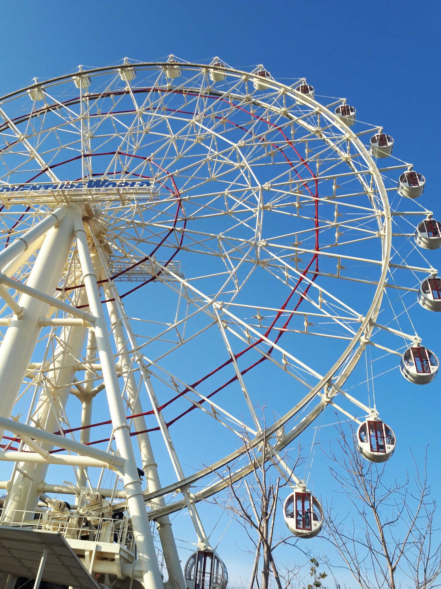 Large Ferris wheel towering under a clear blue sky