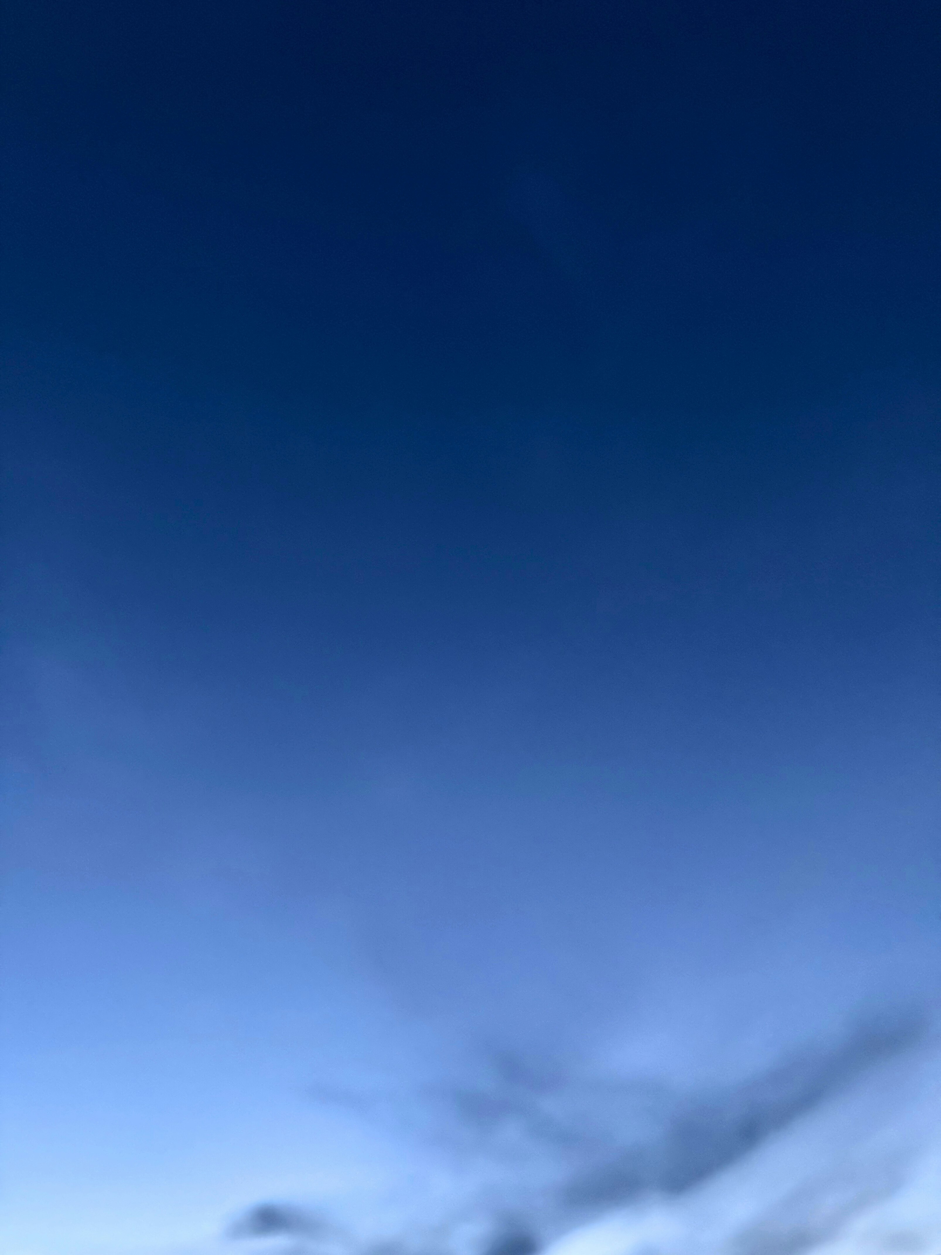 blue sky with drifting clouds