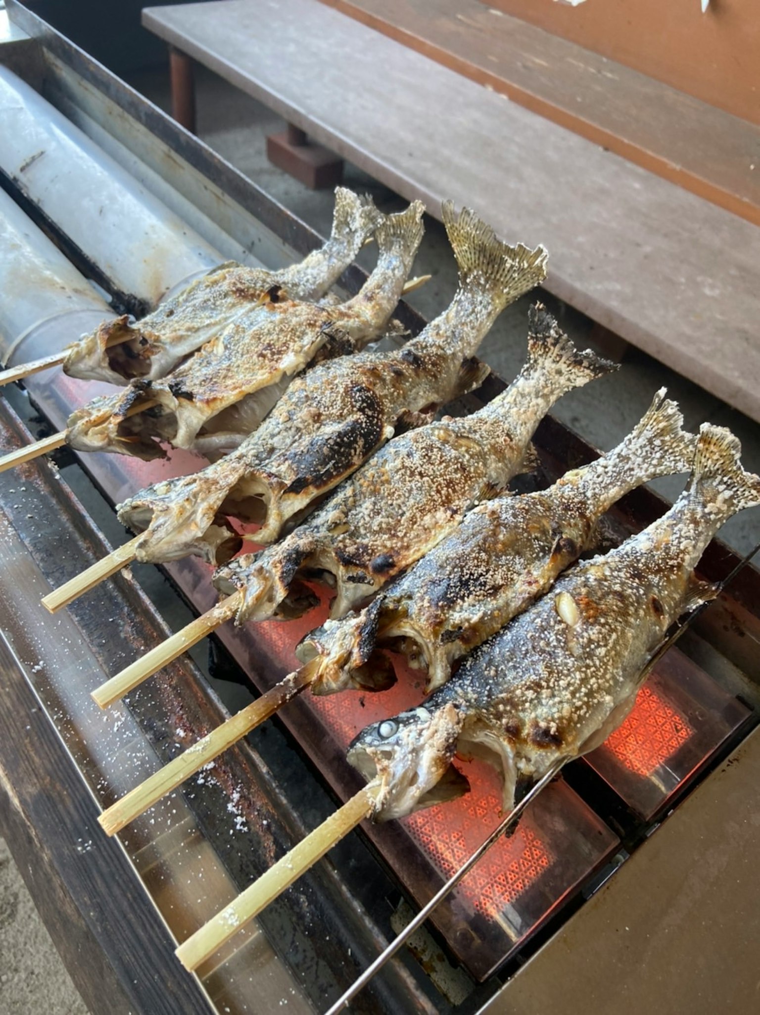Grilled fish skewers on a barbecue grill