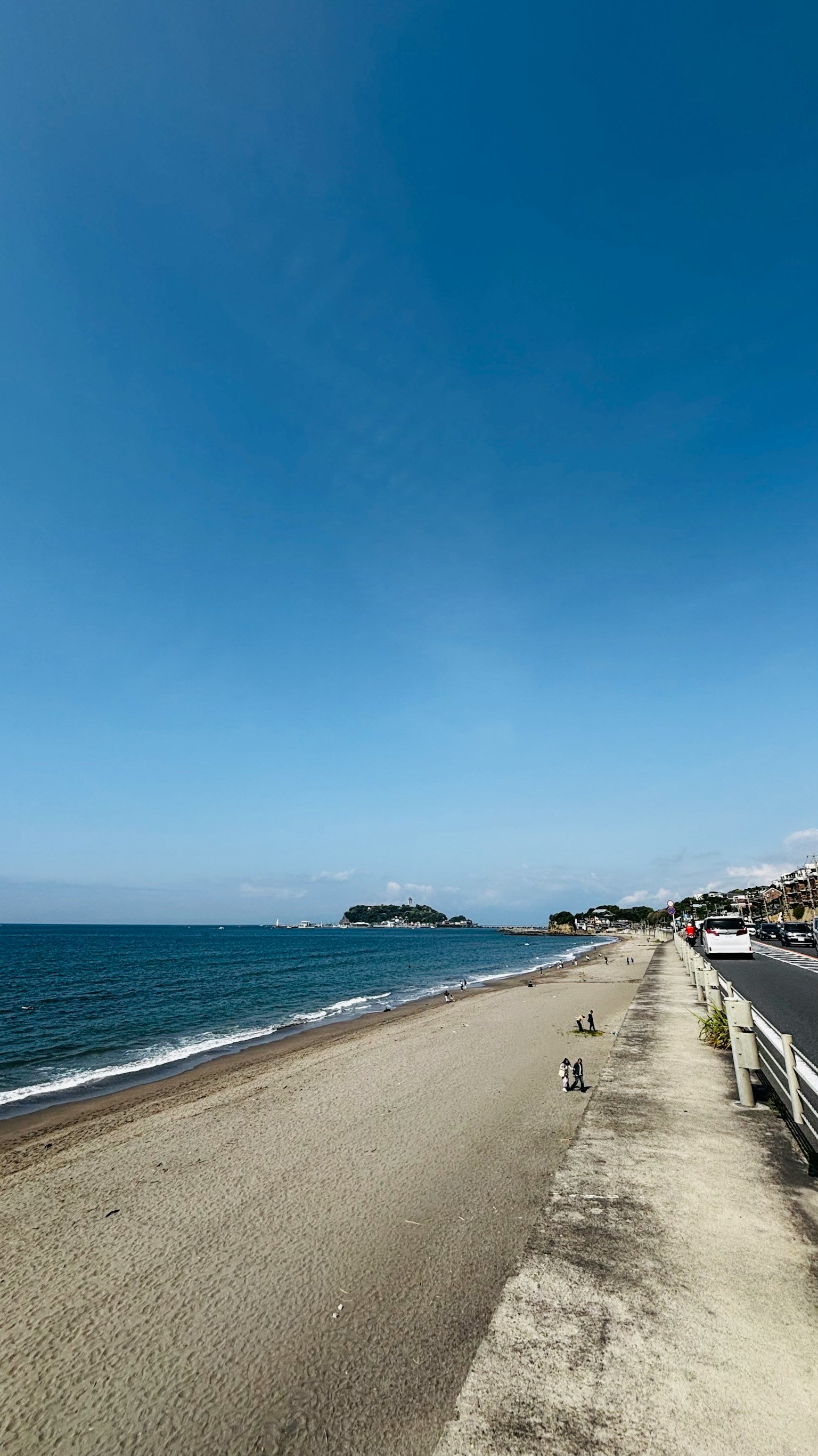 Blue sky and calm sea view Coastal walkway and sandy beach