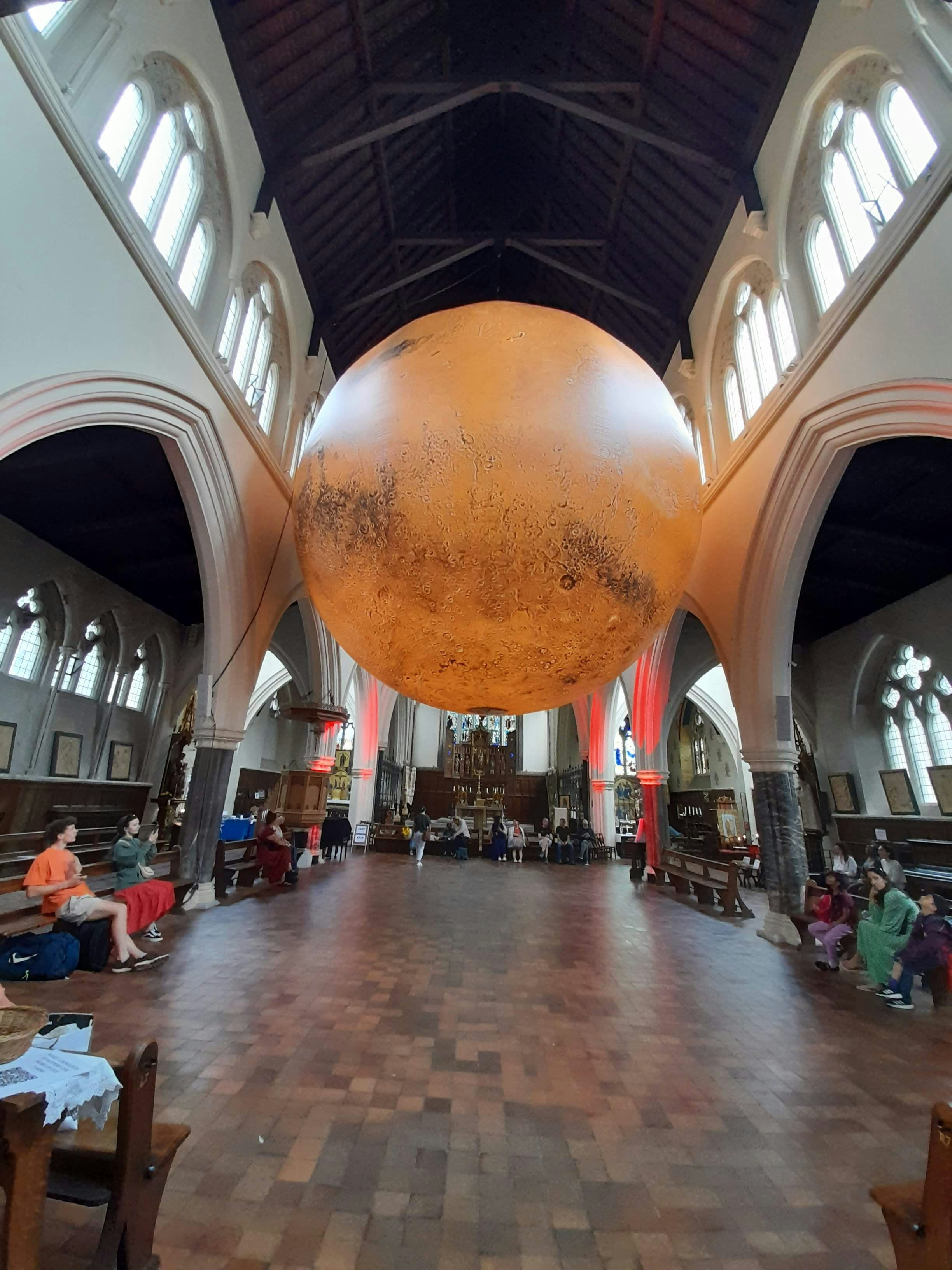 Interior of a large church hall with a domed ceiling
