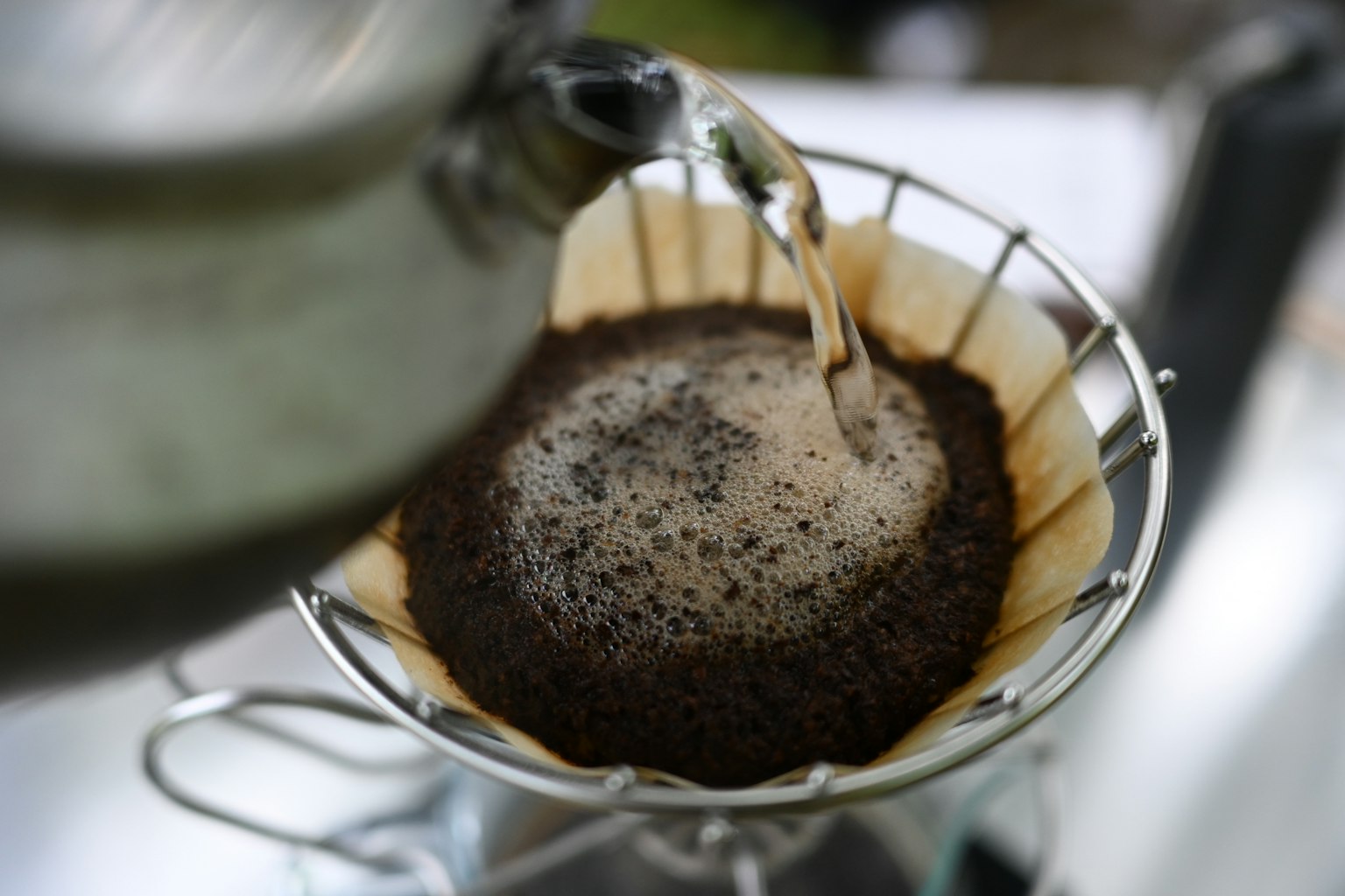 Hot water being poured over coffee grounds in a filter