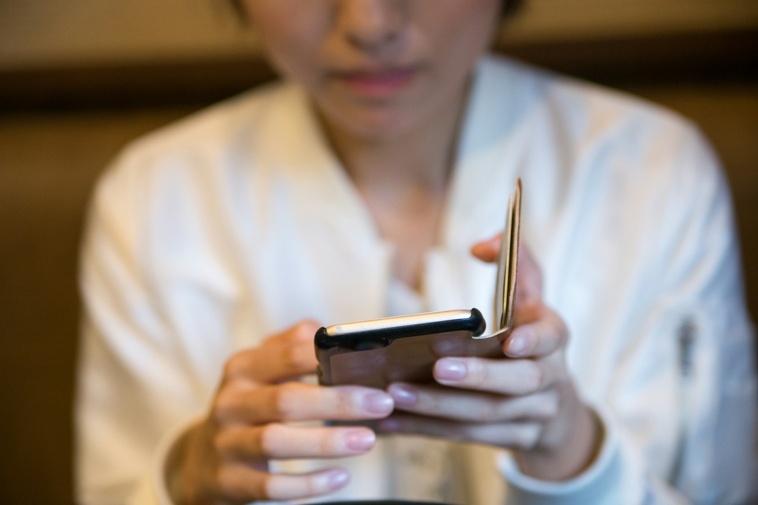 Close-up of a woman holding a smartphone