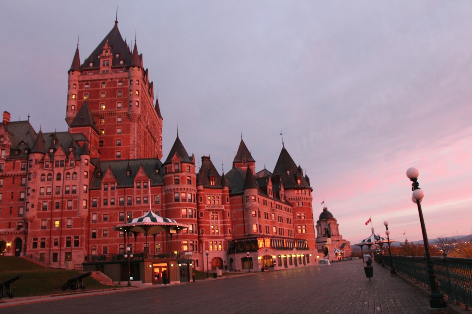 Beautiful exterior of Château Frontenac at dusk with red walls