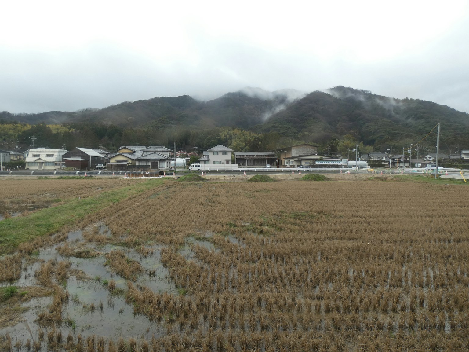 Rural landscape featuring rice fields and mountains in Japan