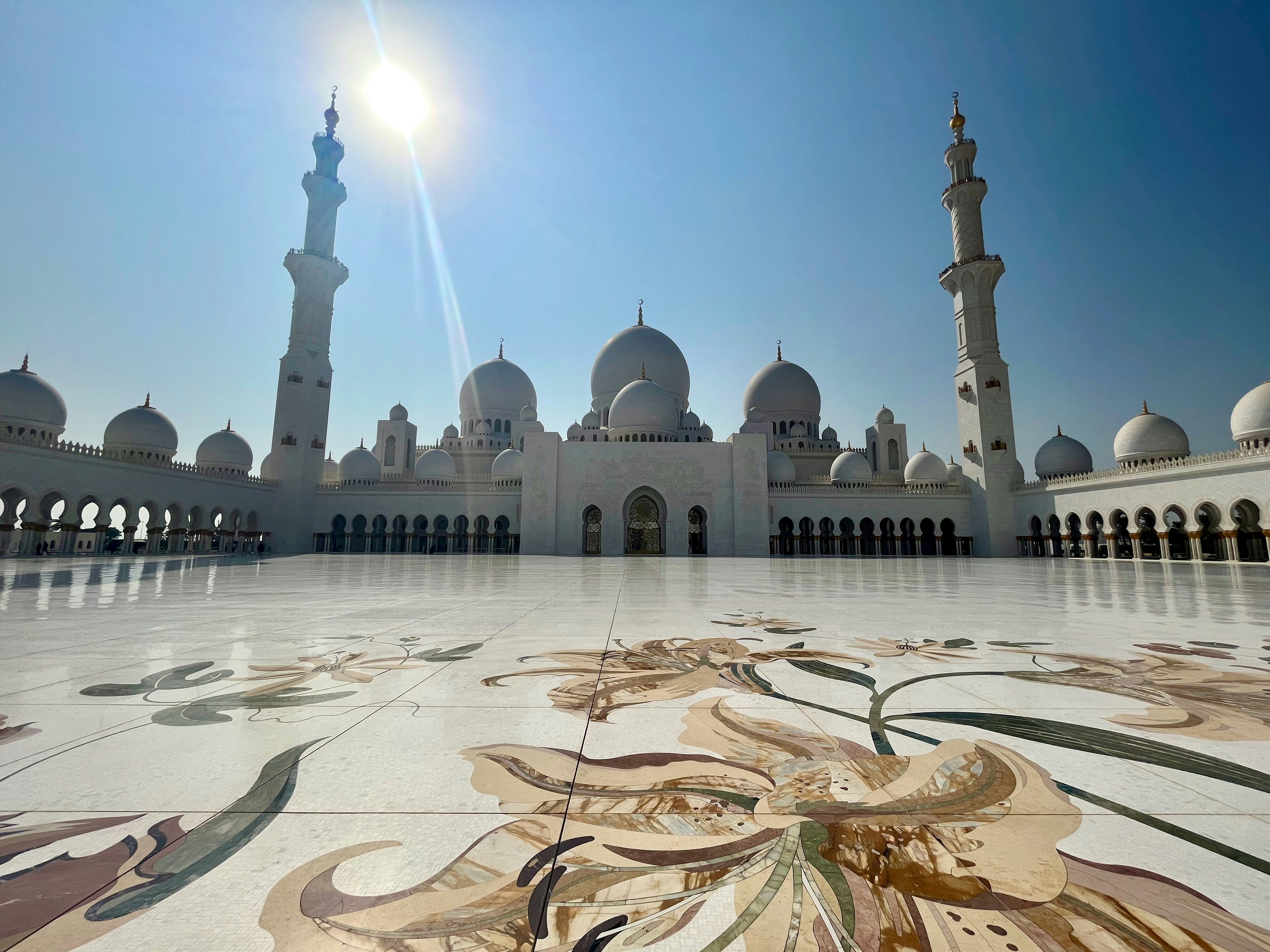 Sheikh Zayed Grand Mosque white domes and marble floor mosaic