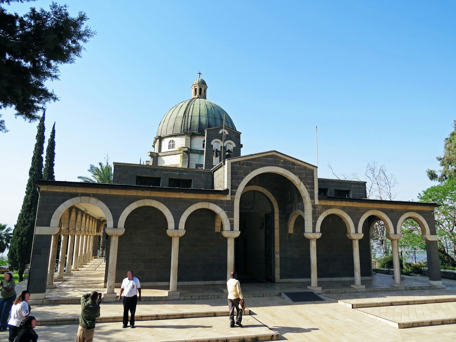 Building with a beautiful dome and arched columns in a scenic setting