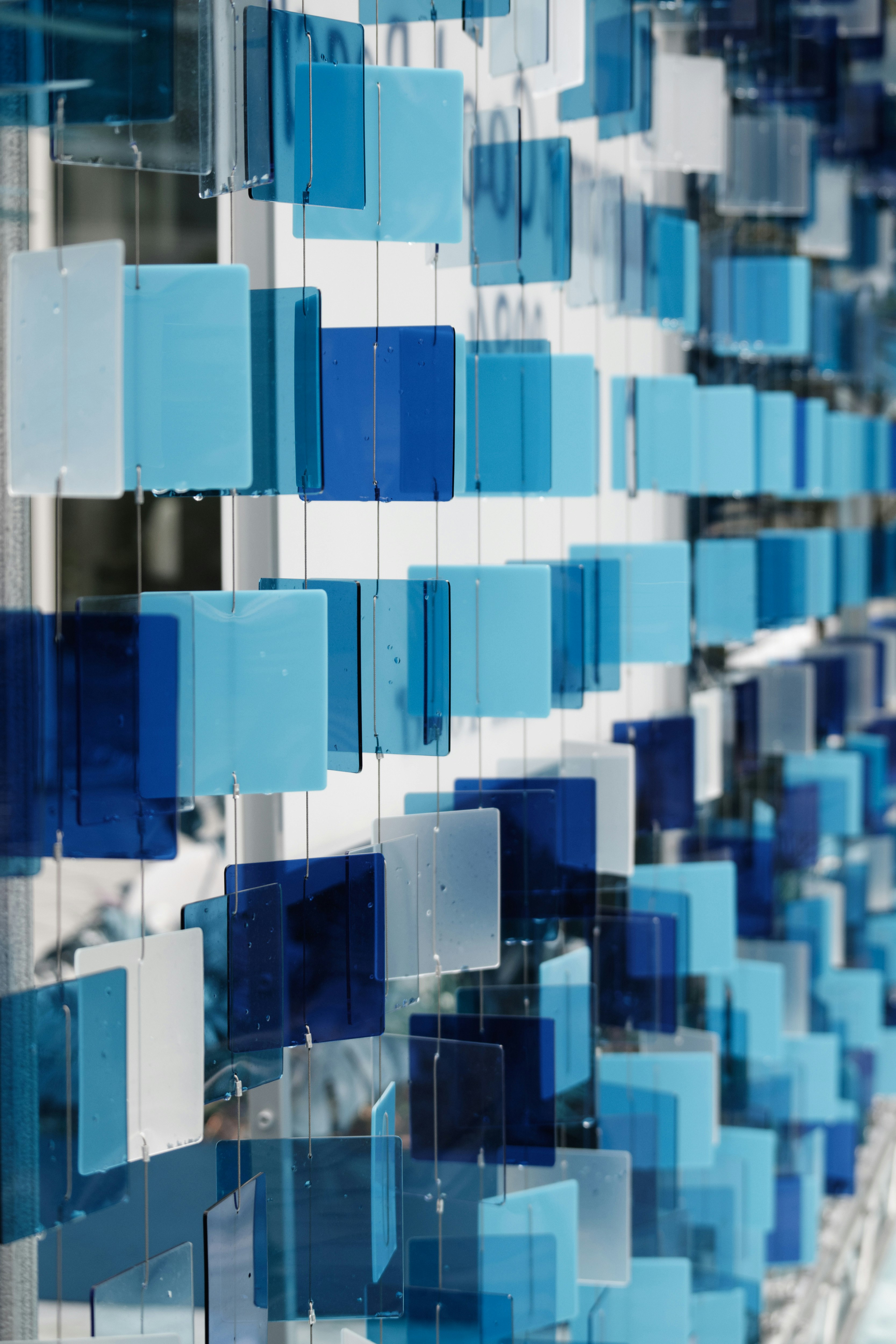 Abstract scene of stacked translucent blue panels evoking summer