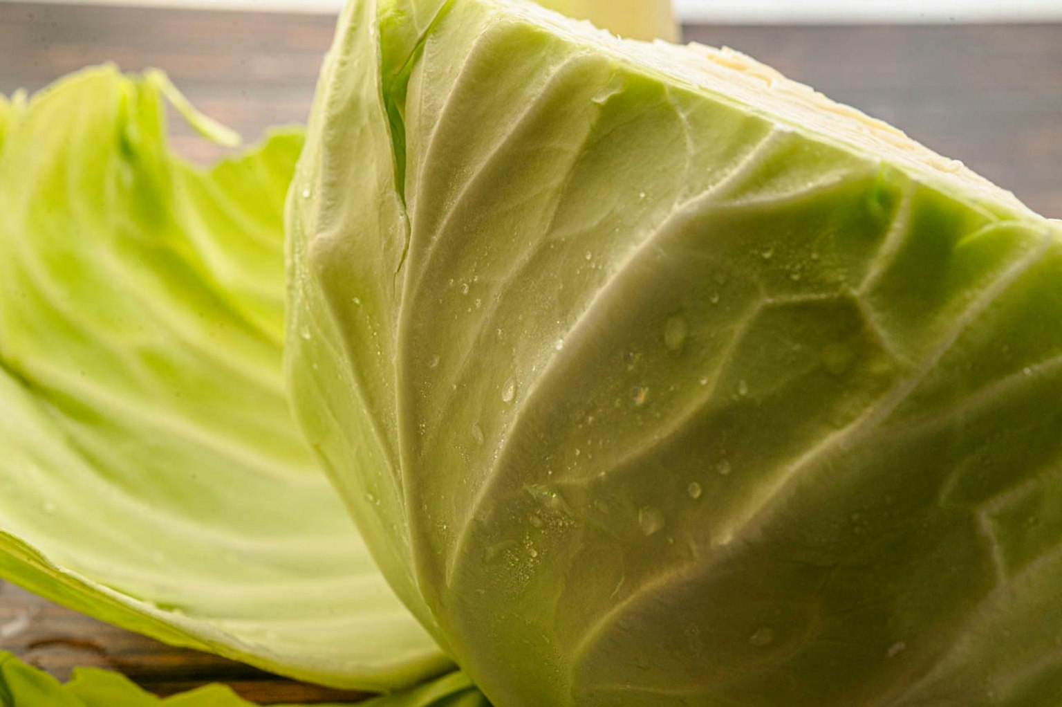 Fresh cabbage cross-section showcasing inner leaves and texture