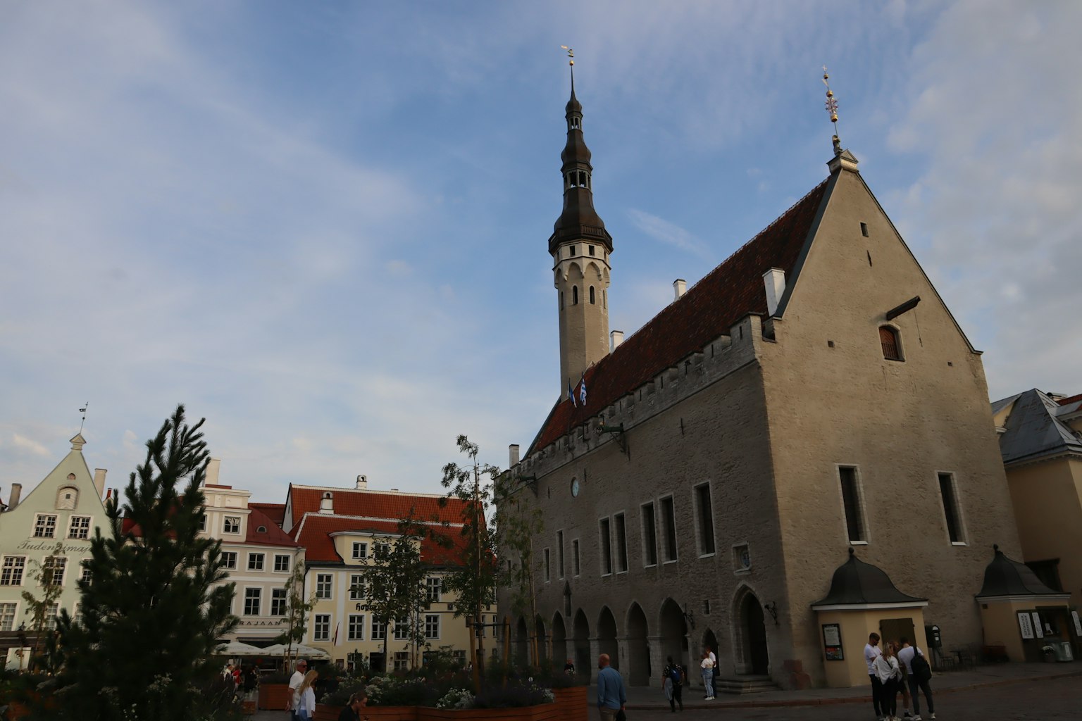Historic building in Tallinn with a tall spire and blue sky