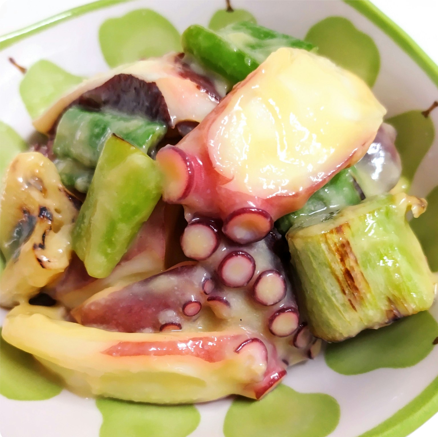 Colorful salad with octopus and assorted vegetables