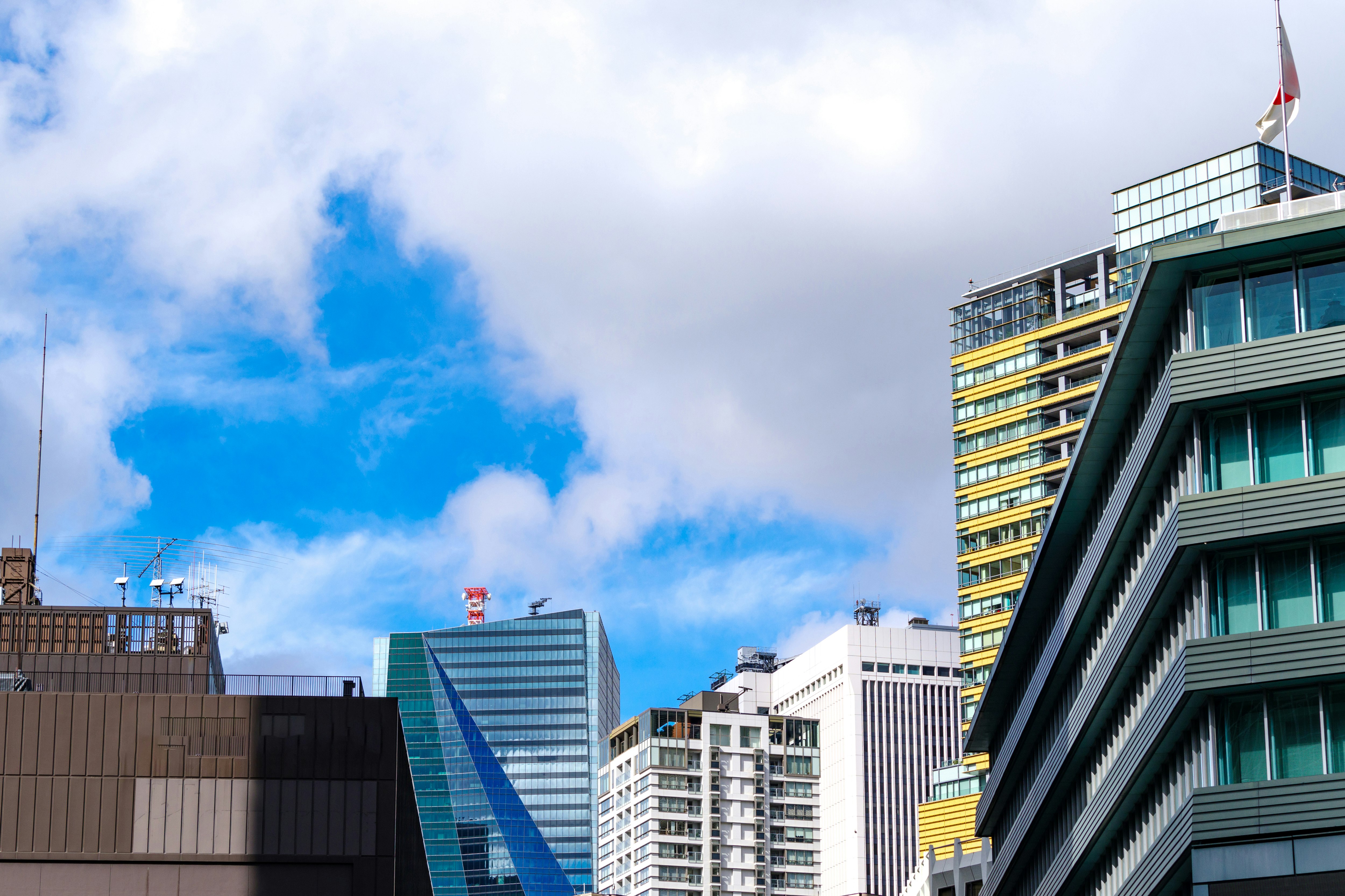 downtown skyline of high-rise buildings under a blue sky