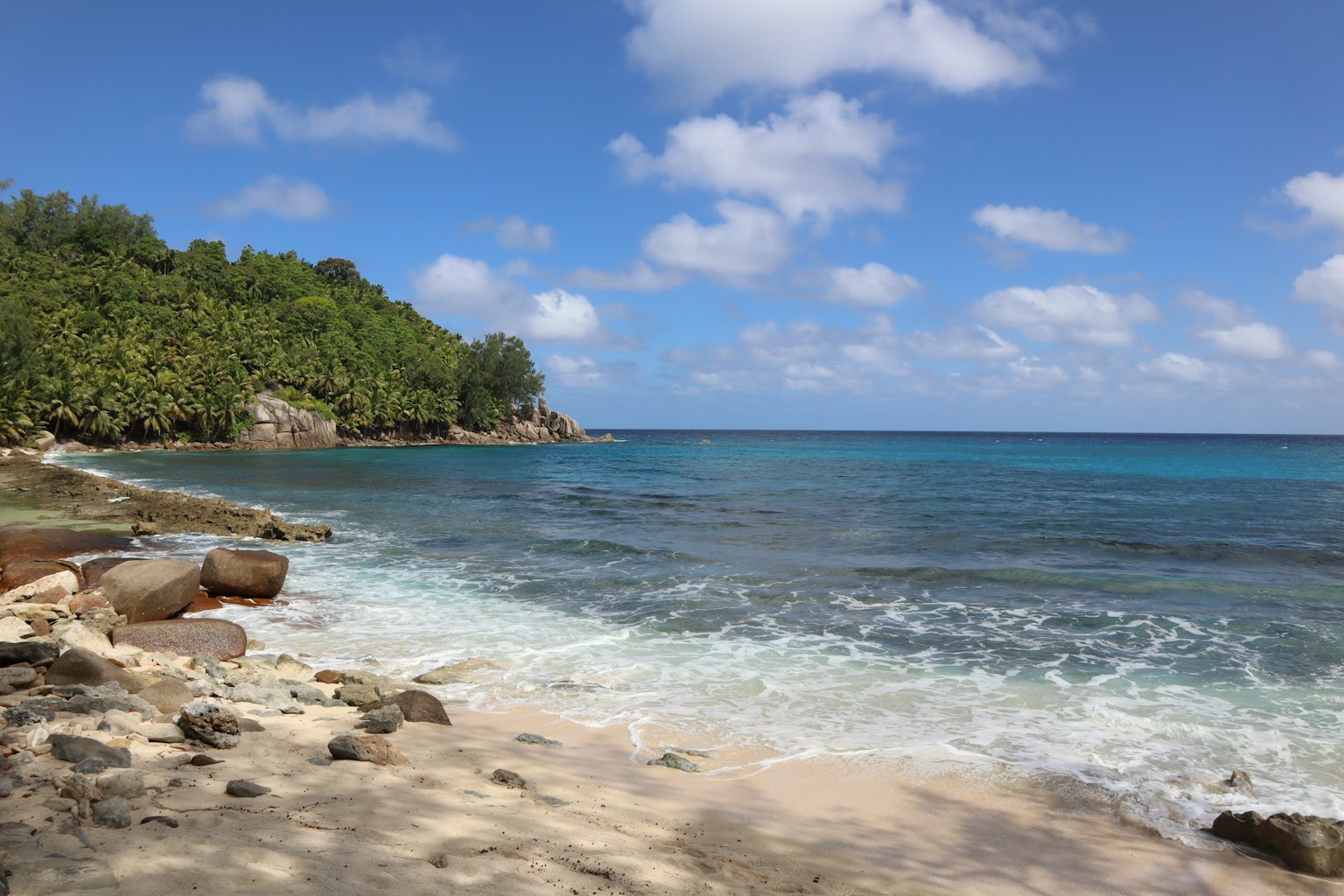 Beautiful beach scene with blue water and white sand