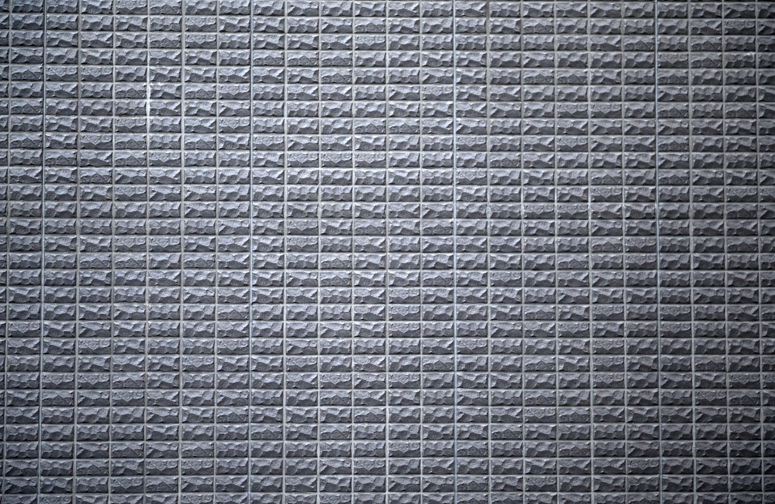 Primo piano di un muro grigio testurizzato