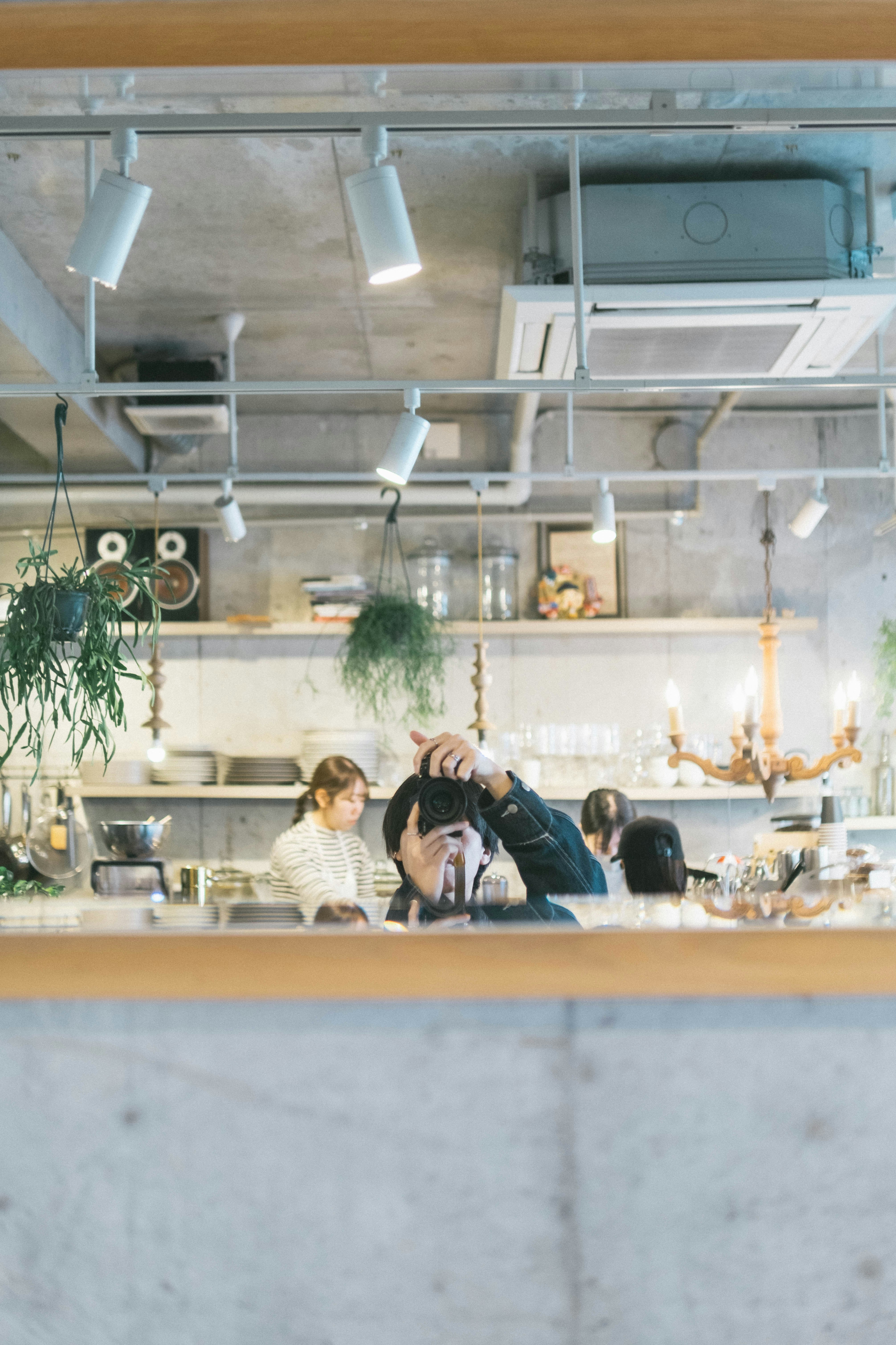 cafe kitchen and staff seen across the counter