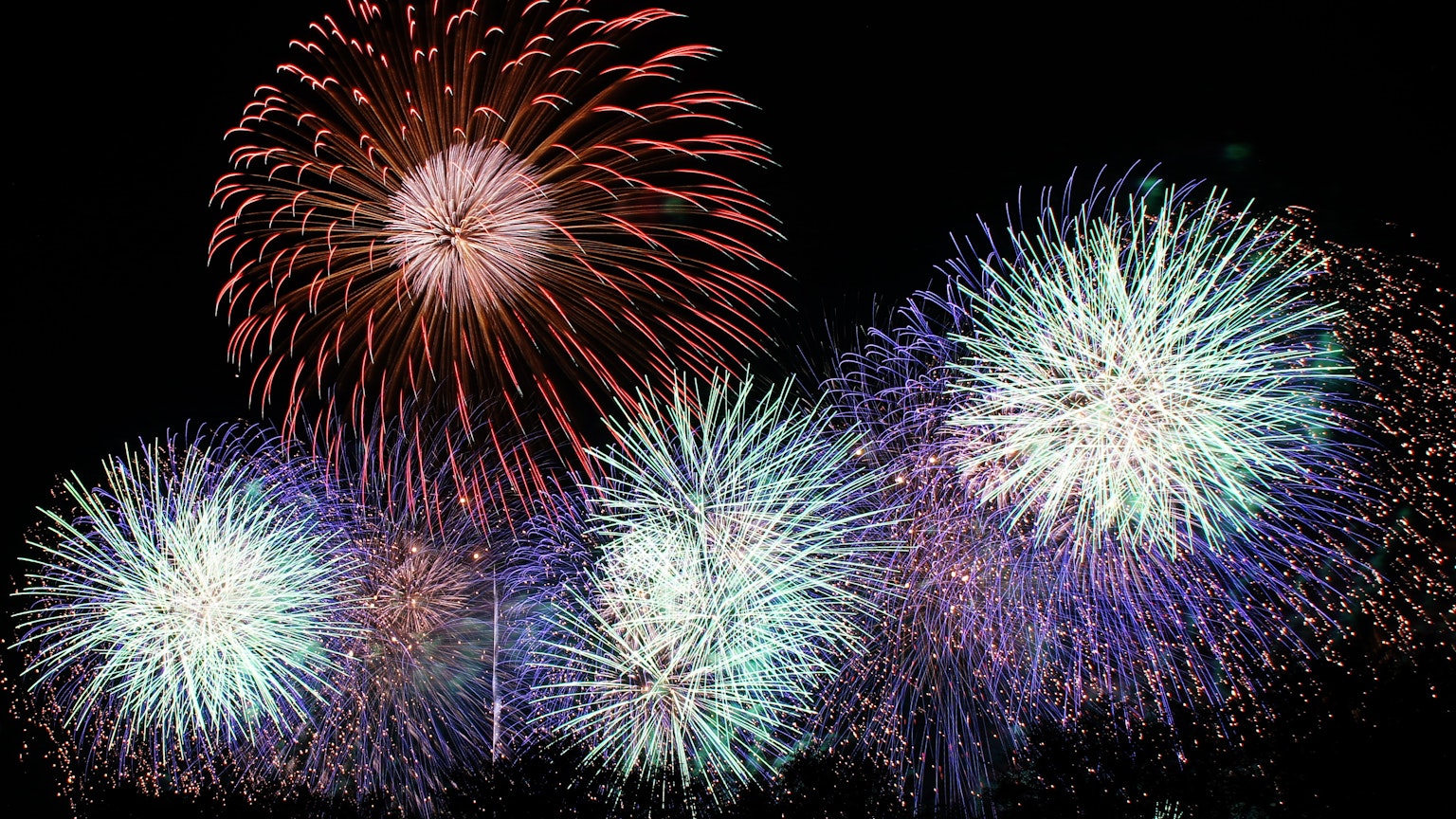 A beautiful display of fireworks lighting up the night sky colorful bursts of sparks