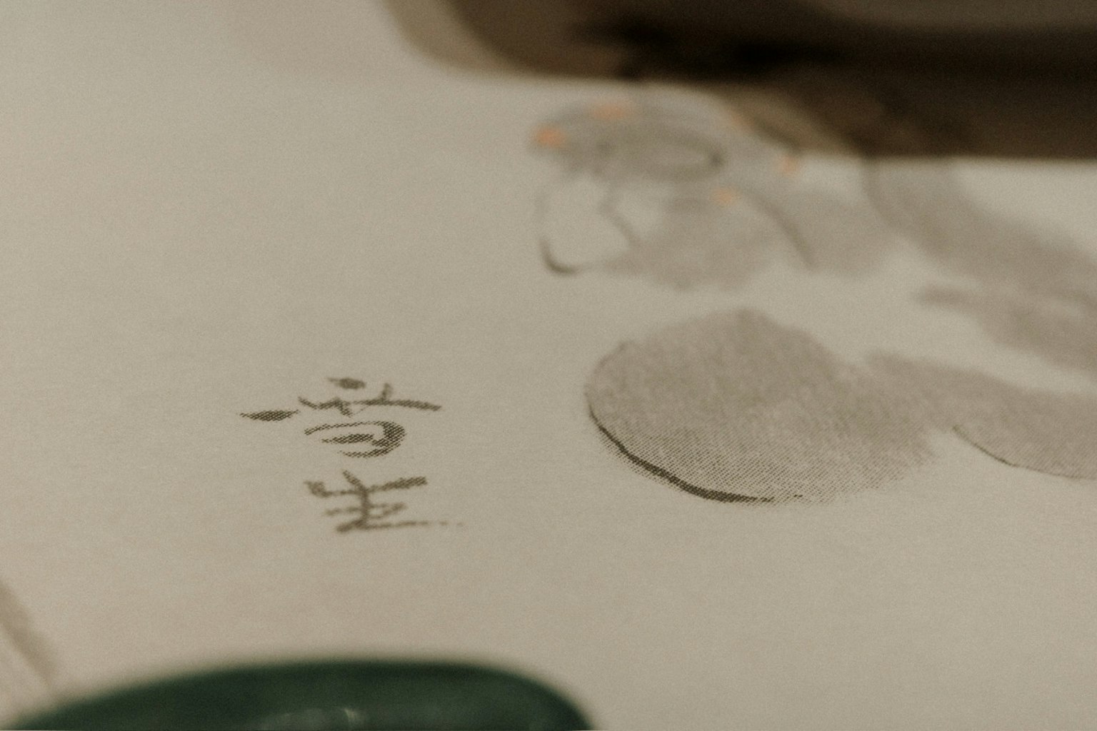 Close-up of a traditional painting with brush strokes on paper