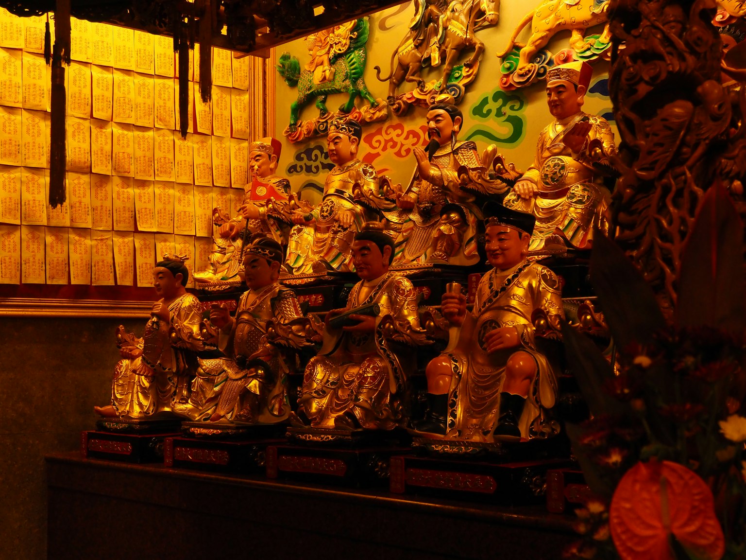 Interior of a shrine featuring golden statues