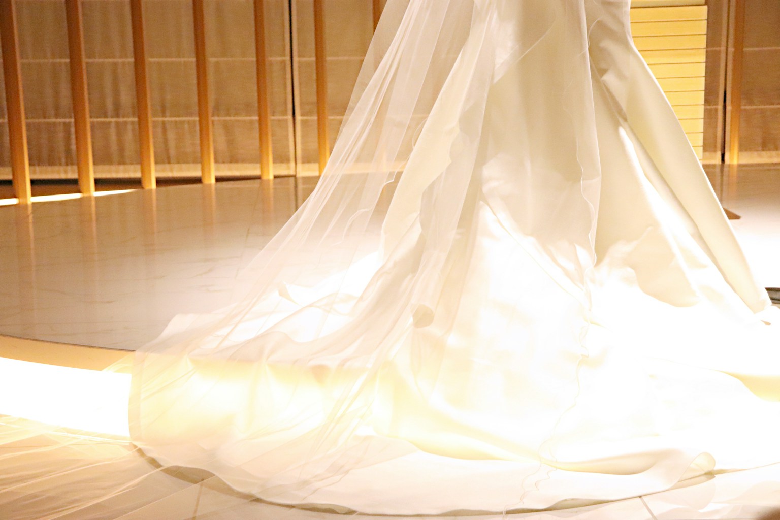 Flowing white dress with delicate fabric in soft light