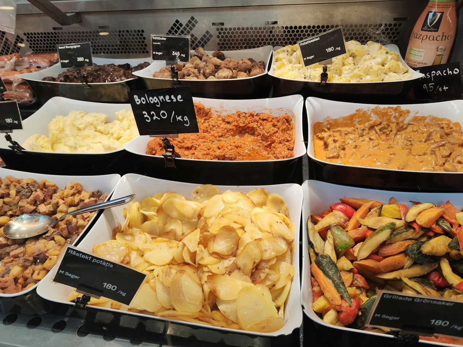 Buffet display featuring various dishes and labels