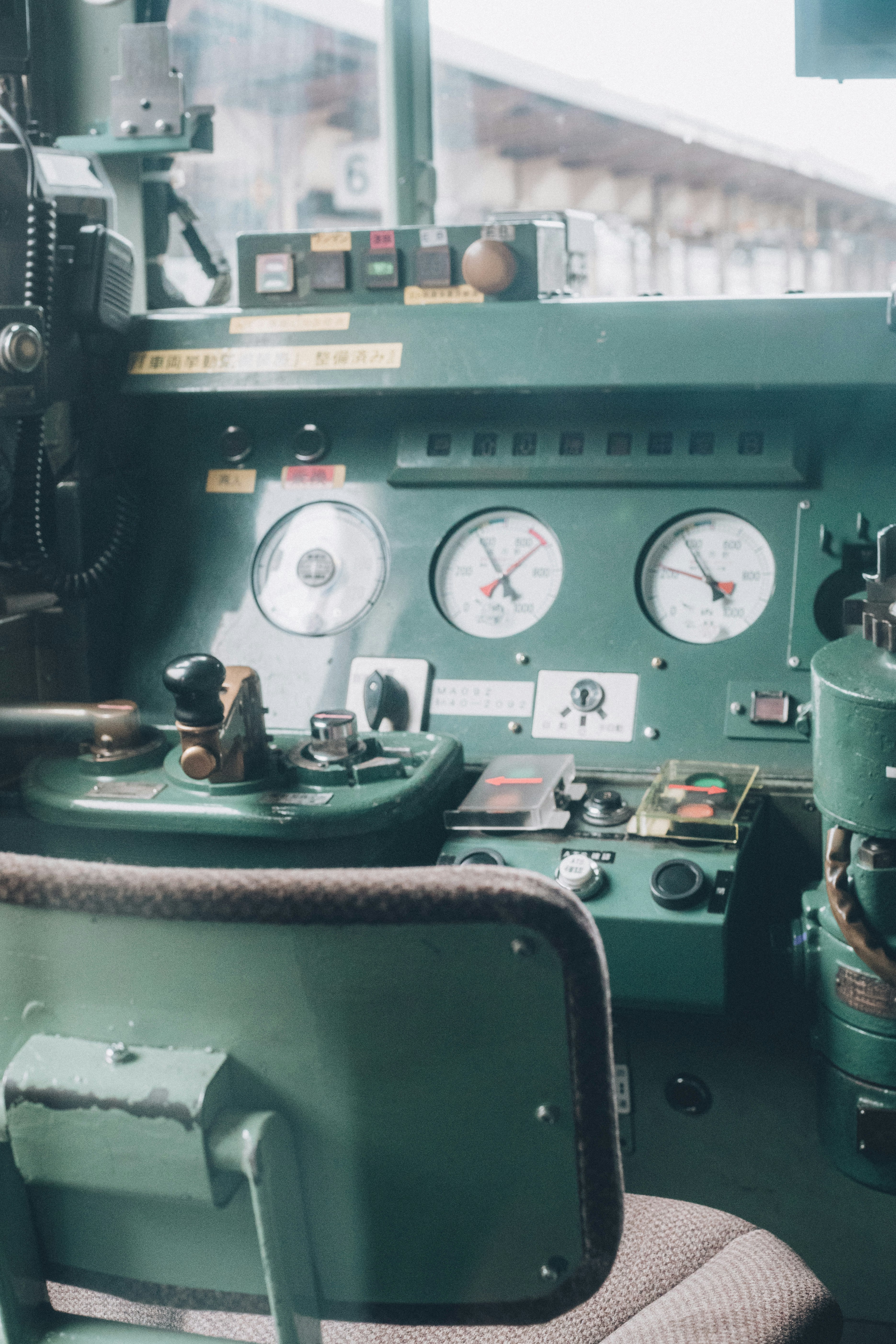 Close-up of a train cab control panel with gauges
