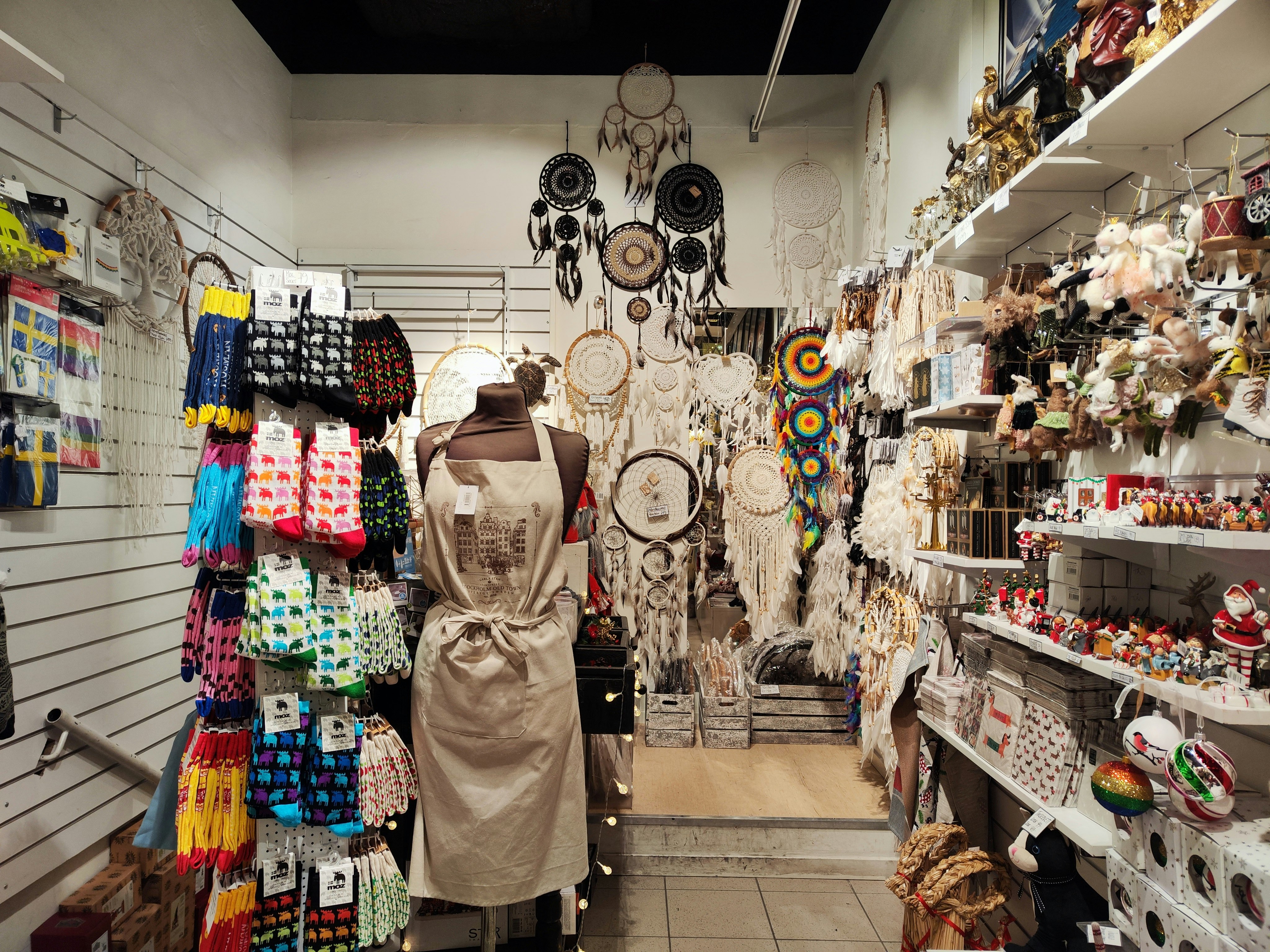 aisle inside a shop lined with handmade crafts