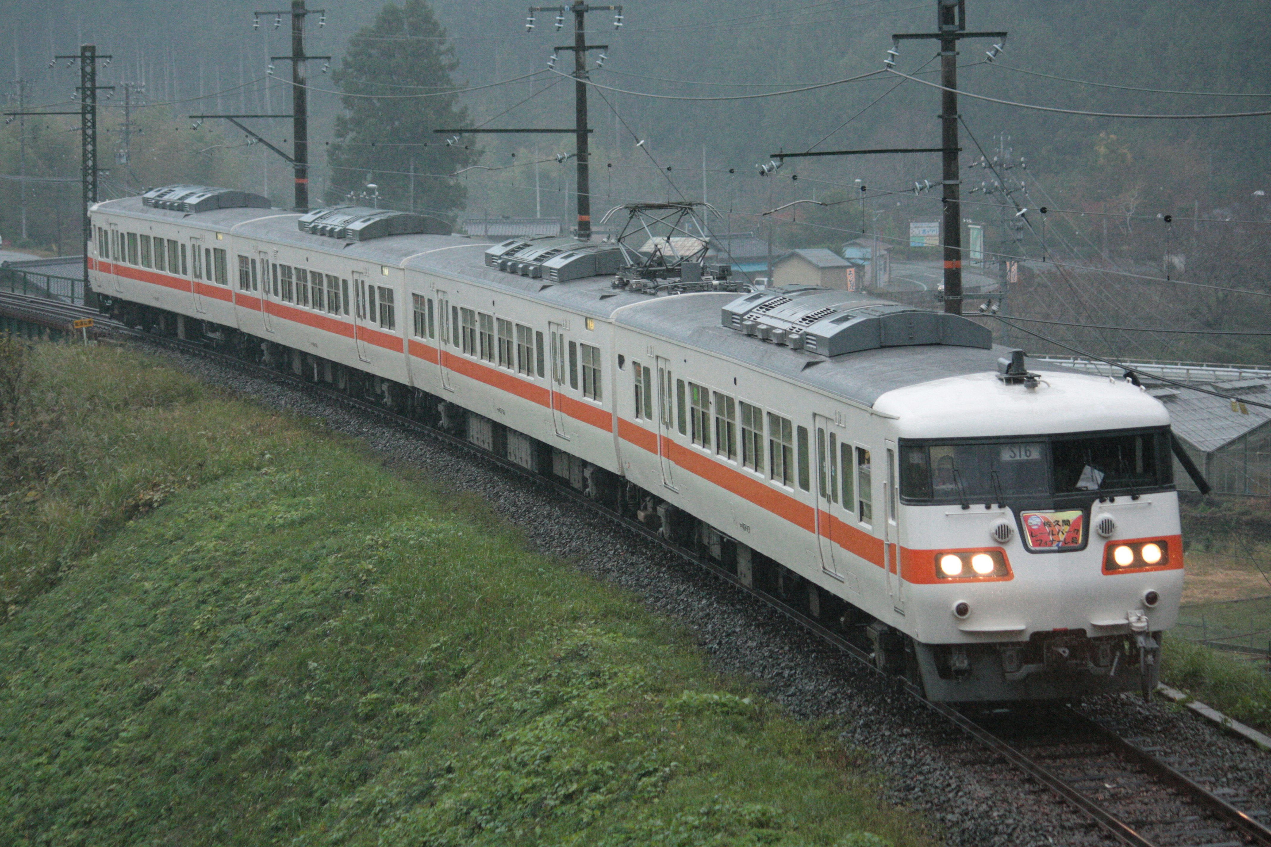 train cars running on tracks in the fog