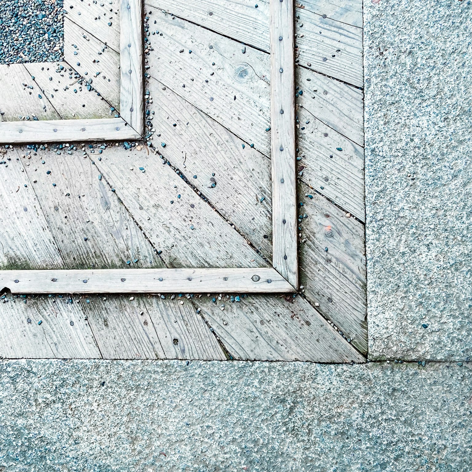 Close-up of a geometric patterned floor with wooden frames