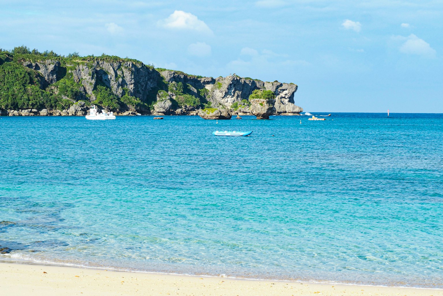Scenic view of a beautiful blue ocean with rocky cliffs