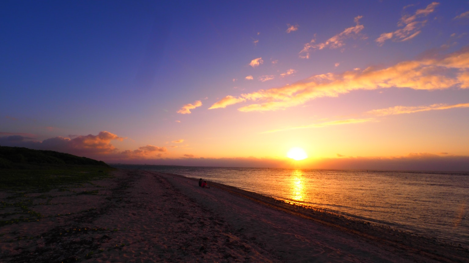 Beautiful sunset over the sea with blue and orange hues