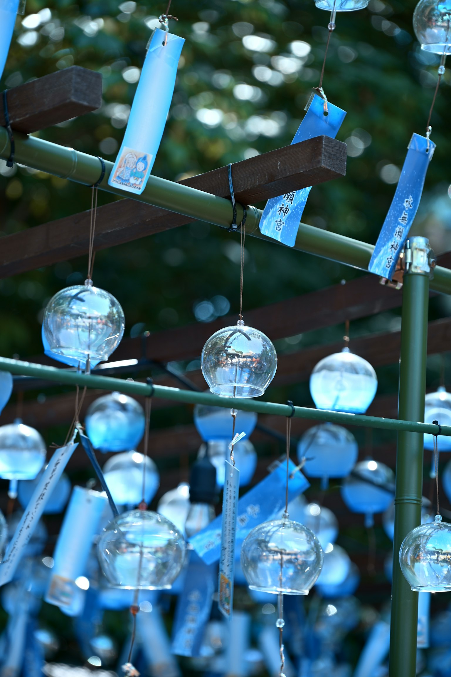 Blue wind chimes hanging in a serene setting