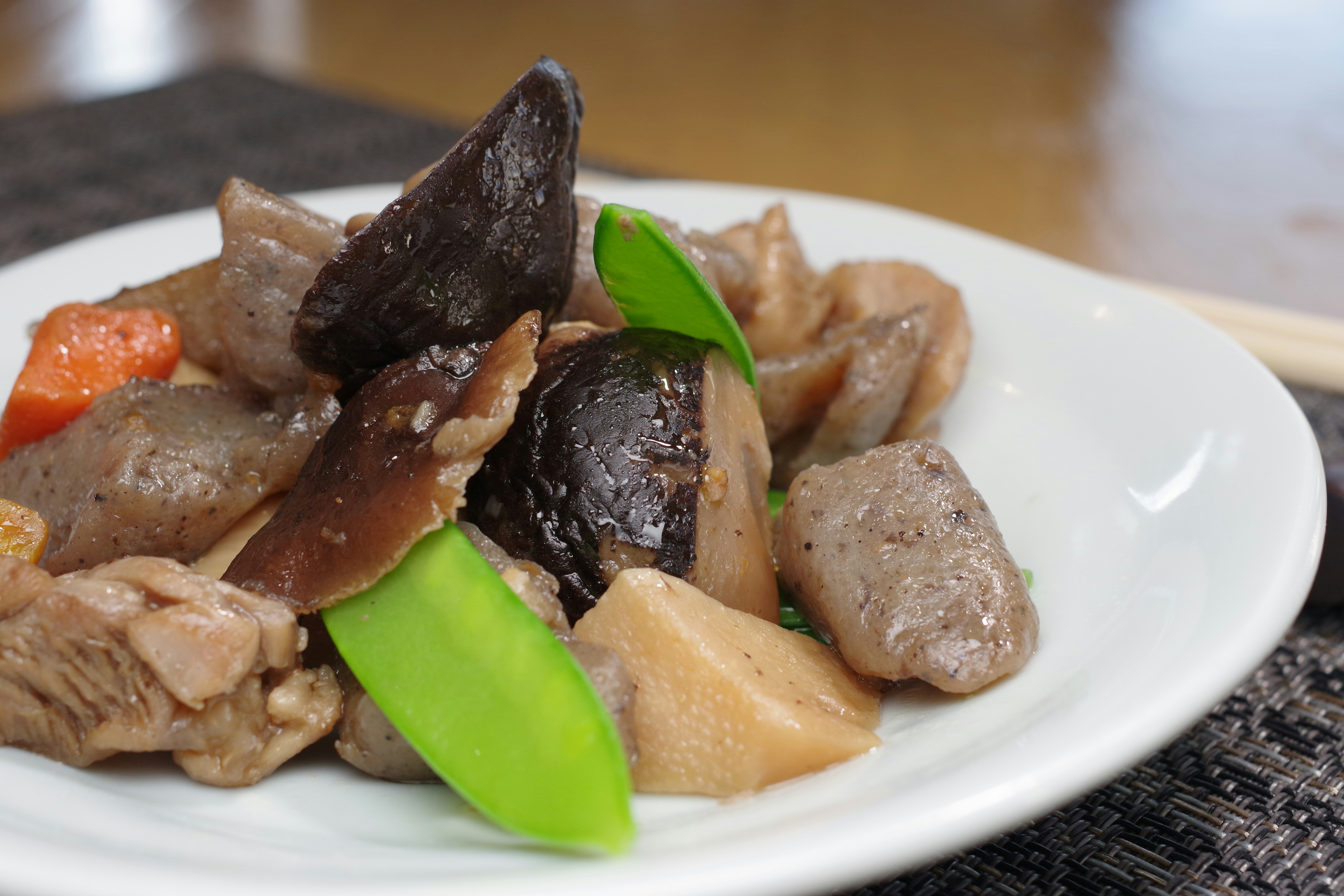 Delicious Japanese-style dish served on a white plate with various ingredients