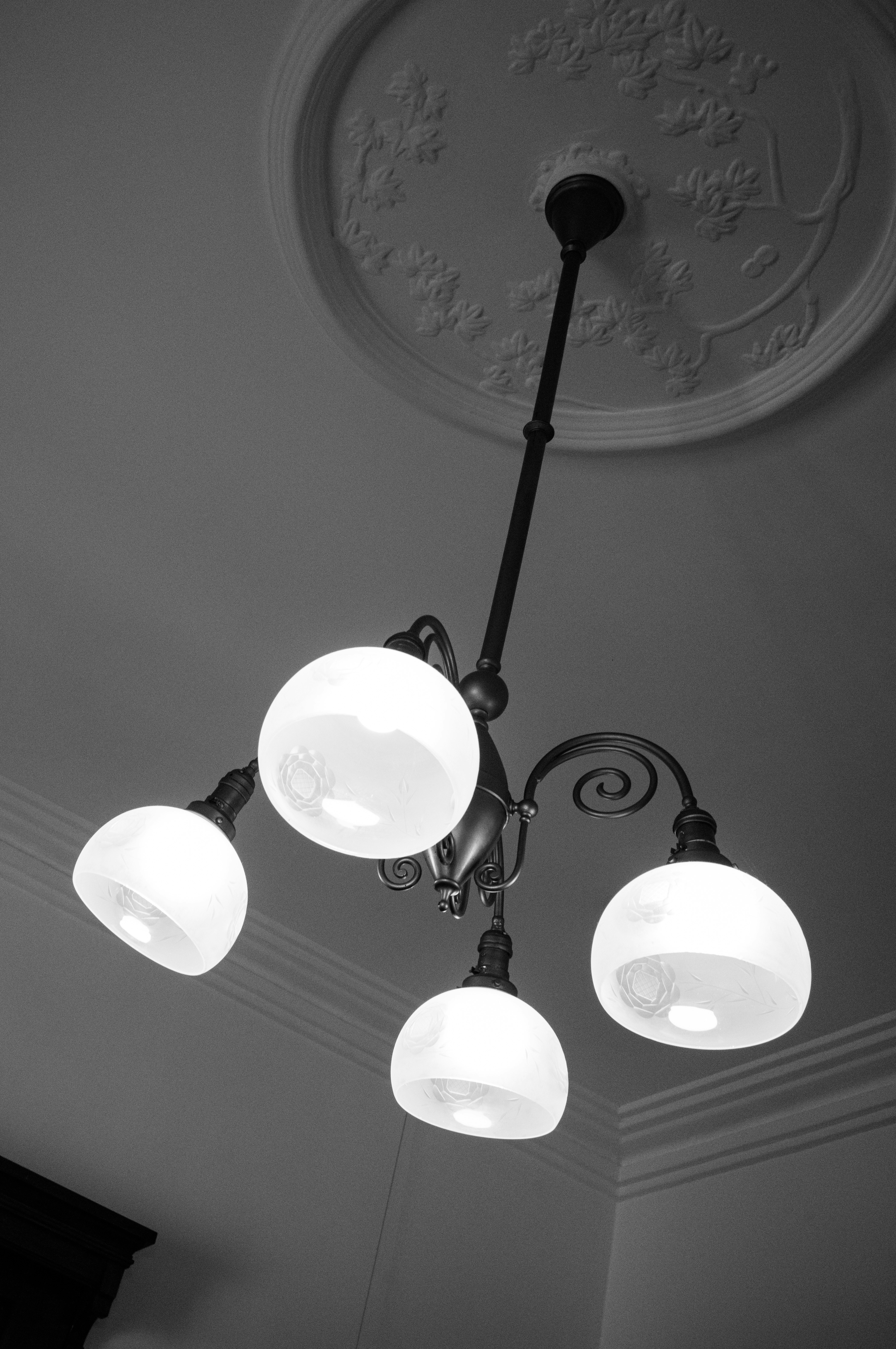 close-up of a ceiling with a chandelier light