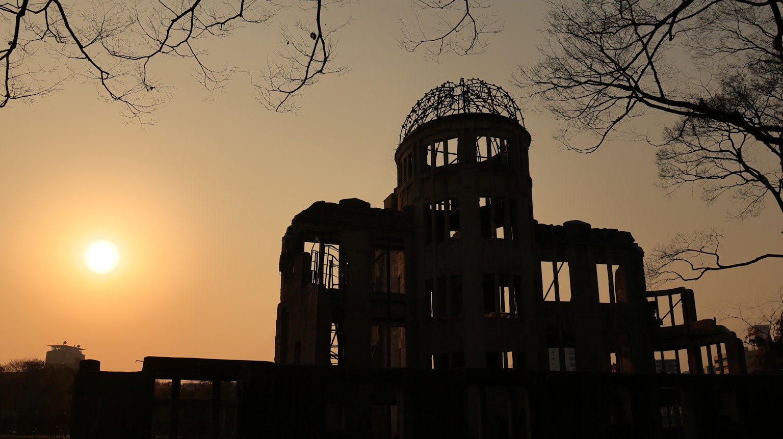 Silhouette of Hiroshima Peace Memorial against sunset