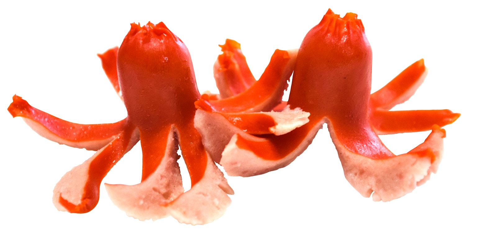 Two red octopus-shaped food items side by side