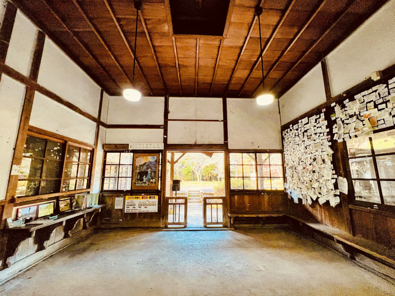 Interior of a traditional room with wooden decor and natural light flowing through windows