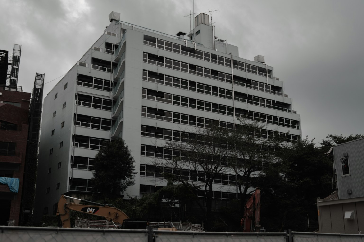 White building exterior against a cloudy sky