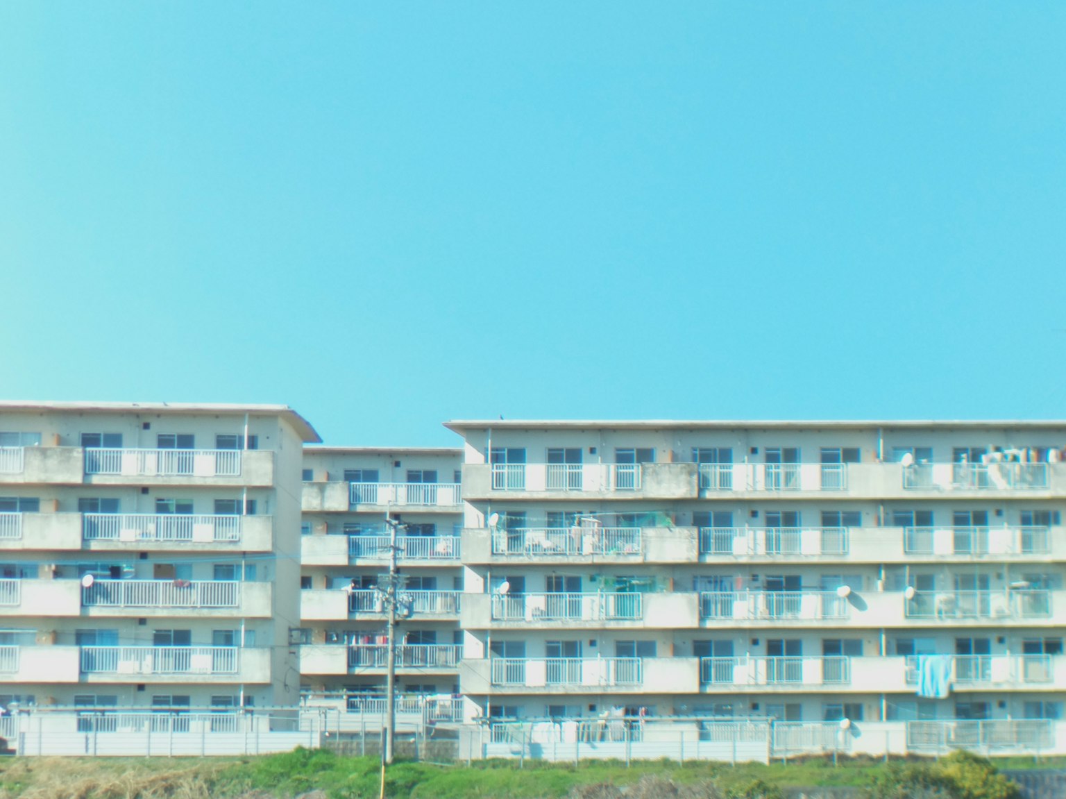 Apartment buildings against a clear blue sky
